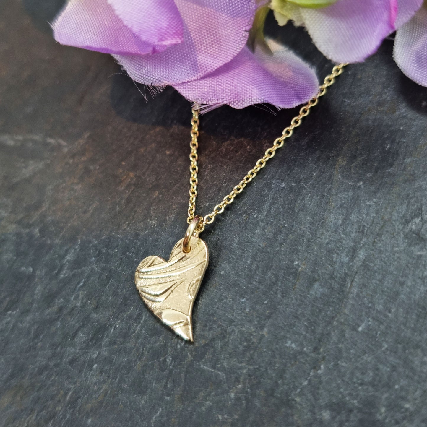 9ct yellow gold patterned asymmetrical heart pendant on chain with flowers