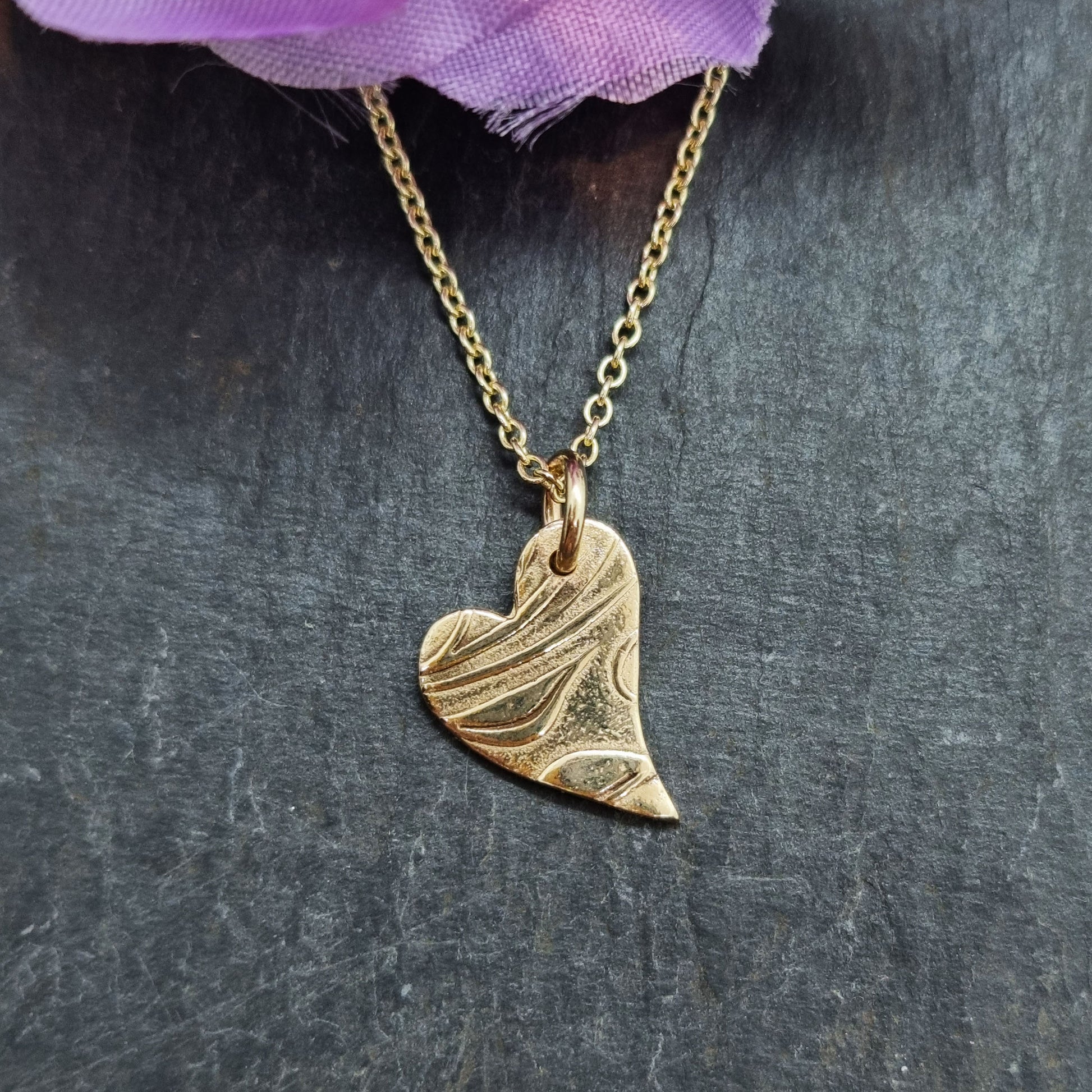 9ct yellow gold patterned asymmetrical heart pendant on chain with flowers