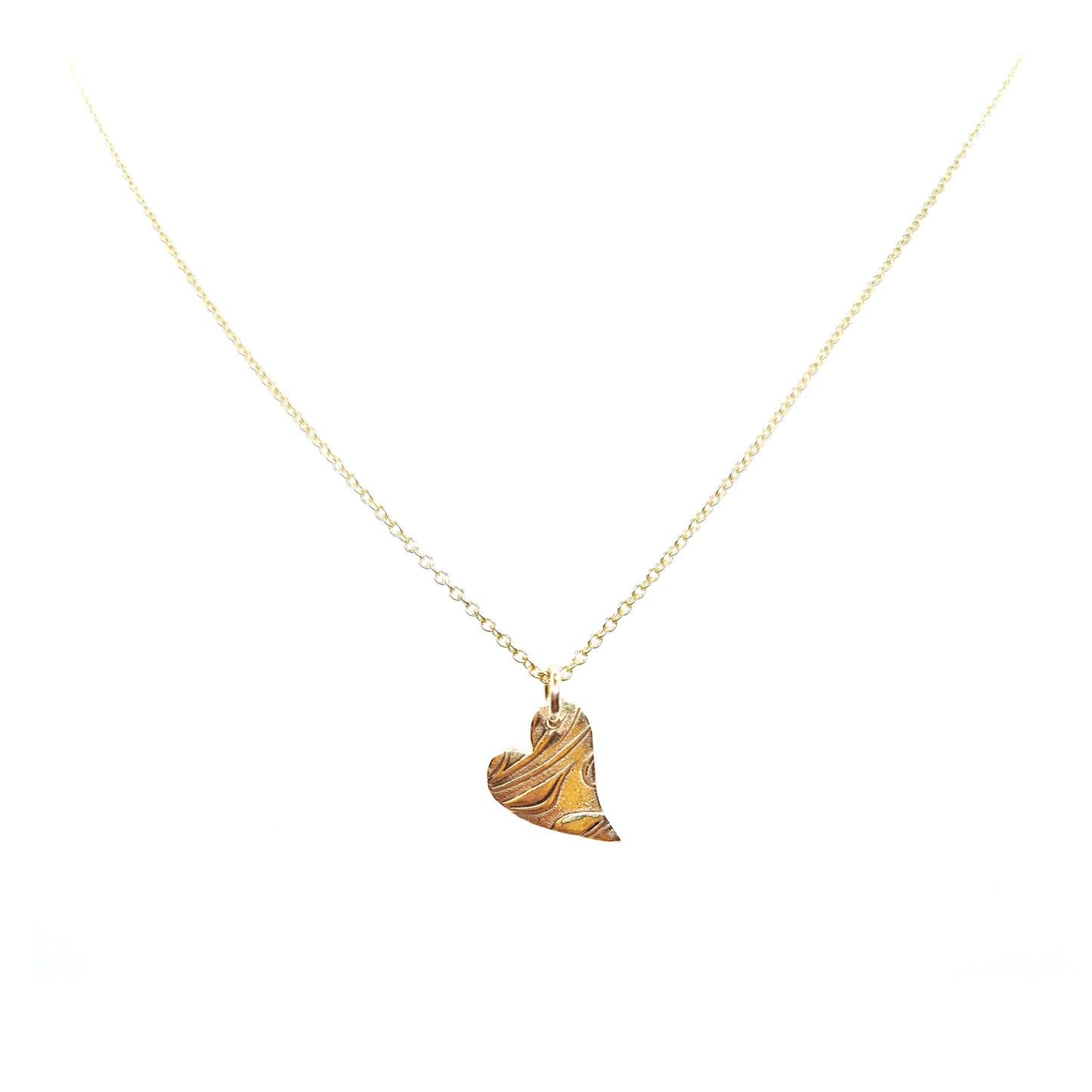 9ct yellow gold patterned asymmetrical heart pendant on chain.