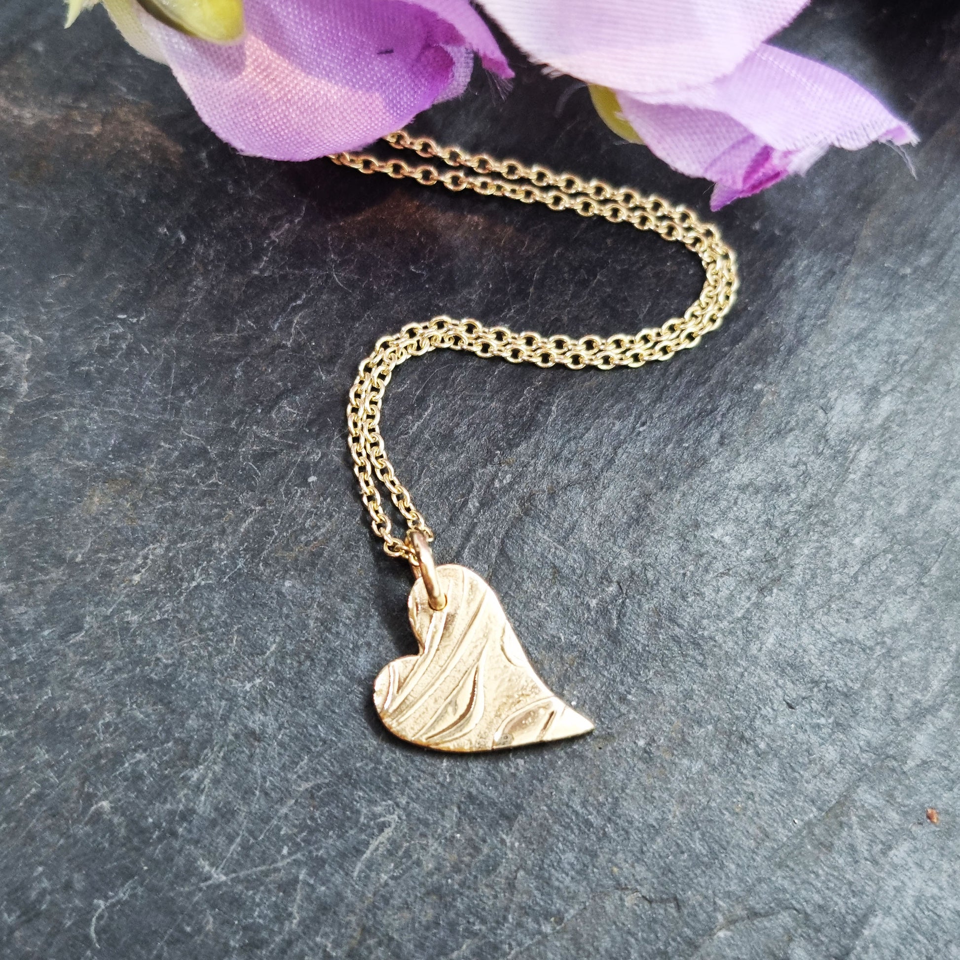 9ct yellow gold patterned asymmetrical heart pendant on chain with flowers