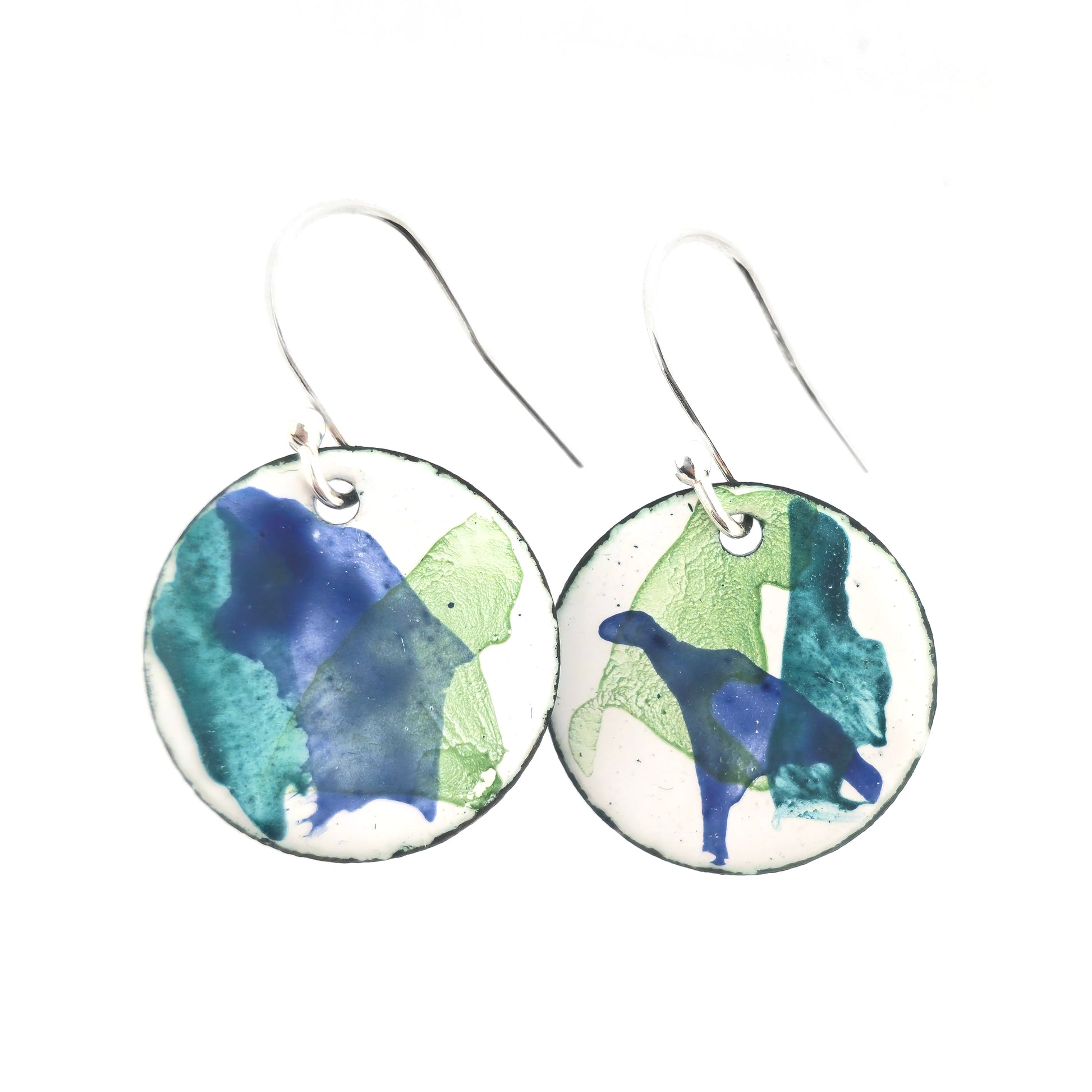 Round enamel drop earrings with splashes of dark blue and green on a white background. Small.