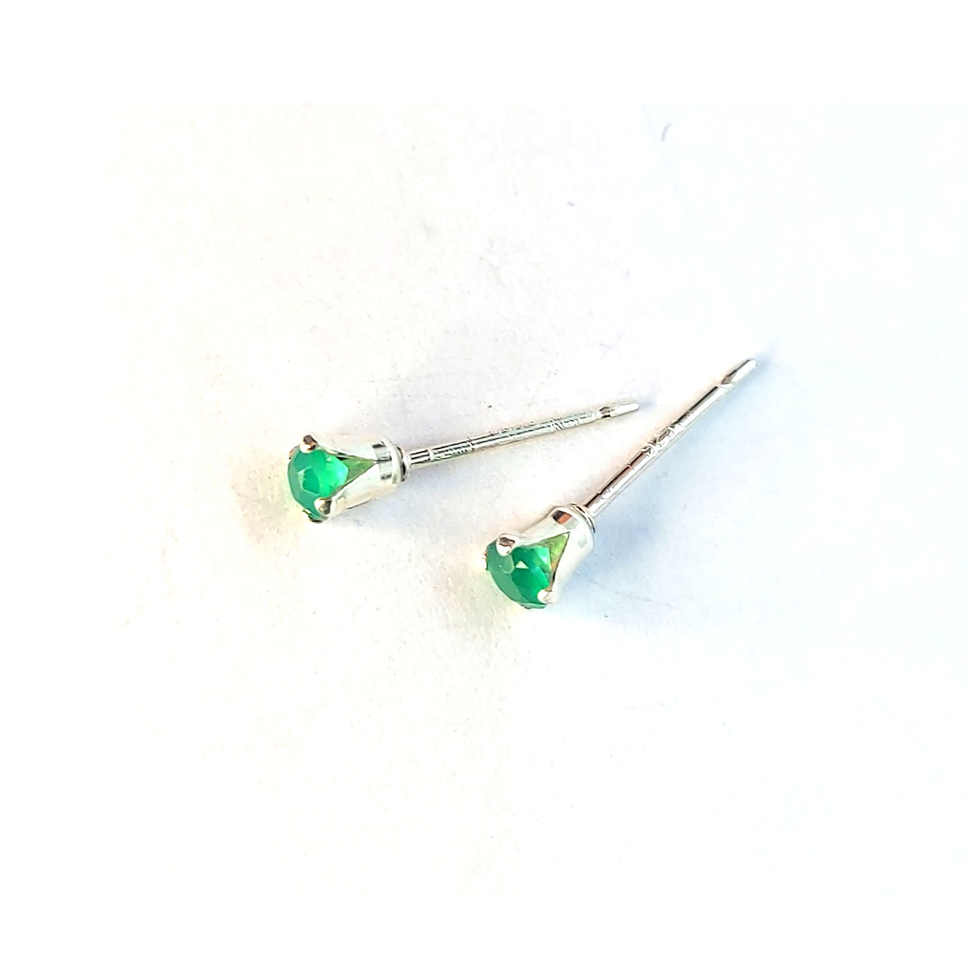 Silver 4 claw stud earrings with faceted green agate gemstones.