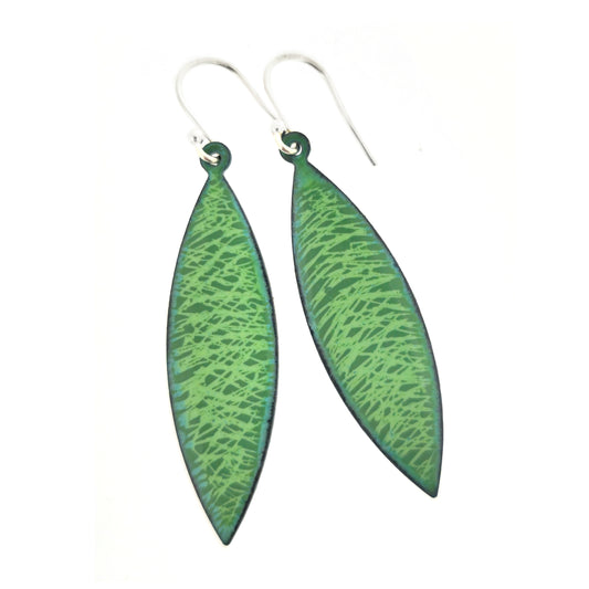 Boat-shaped drop earrings with a green enamel scatter line pattern, suspended from silver ear hooks.