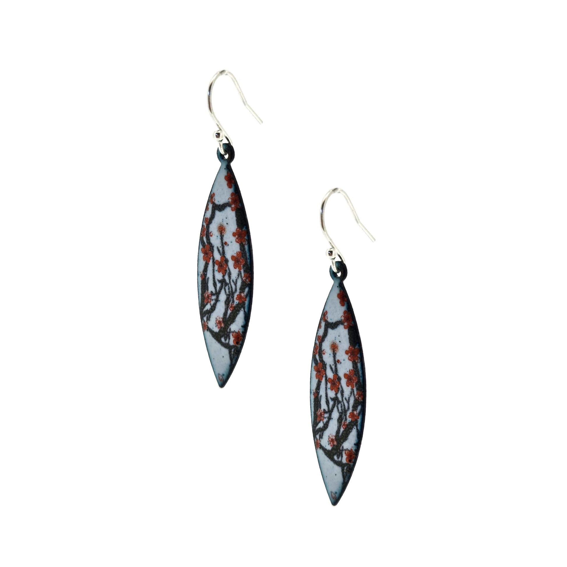 Boat-shaped enamel drop earrings with branches of red cherry blossom on a grey background.