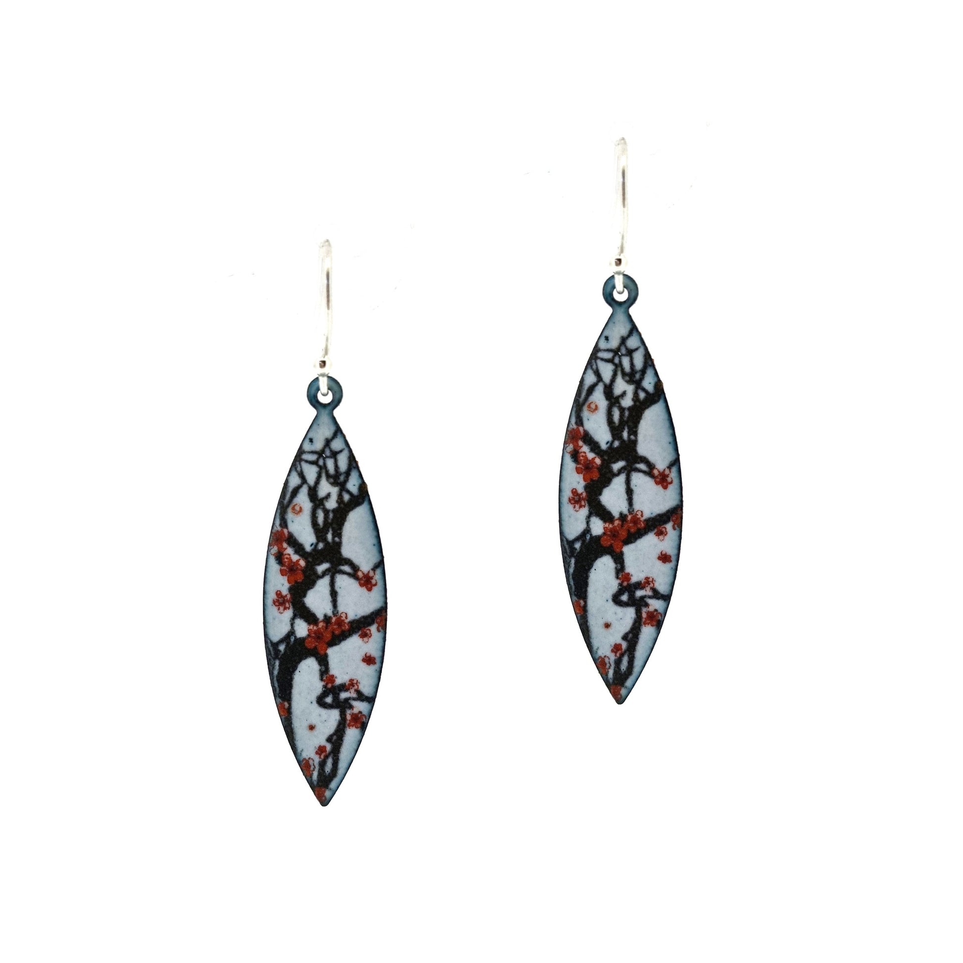 Boat-shaped enamel drop earrings with branches of red cherry blossom on a grey background.