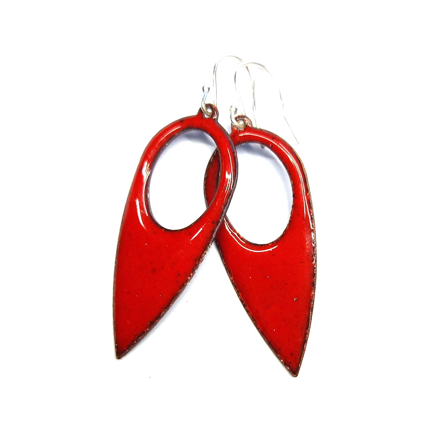 Red enamel drop earrings. These large earrings are teardrop-shaped with a cut out hole.