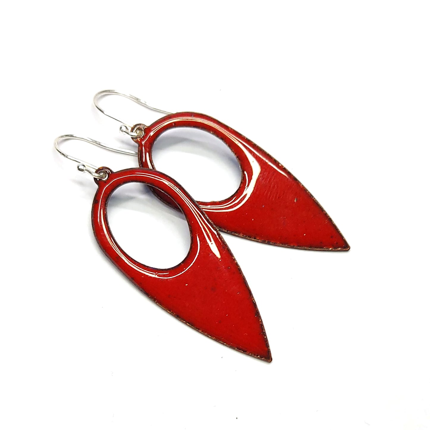 Red enamel drop earrings. These large earrings are teardrop-shaped with a cut out hole.