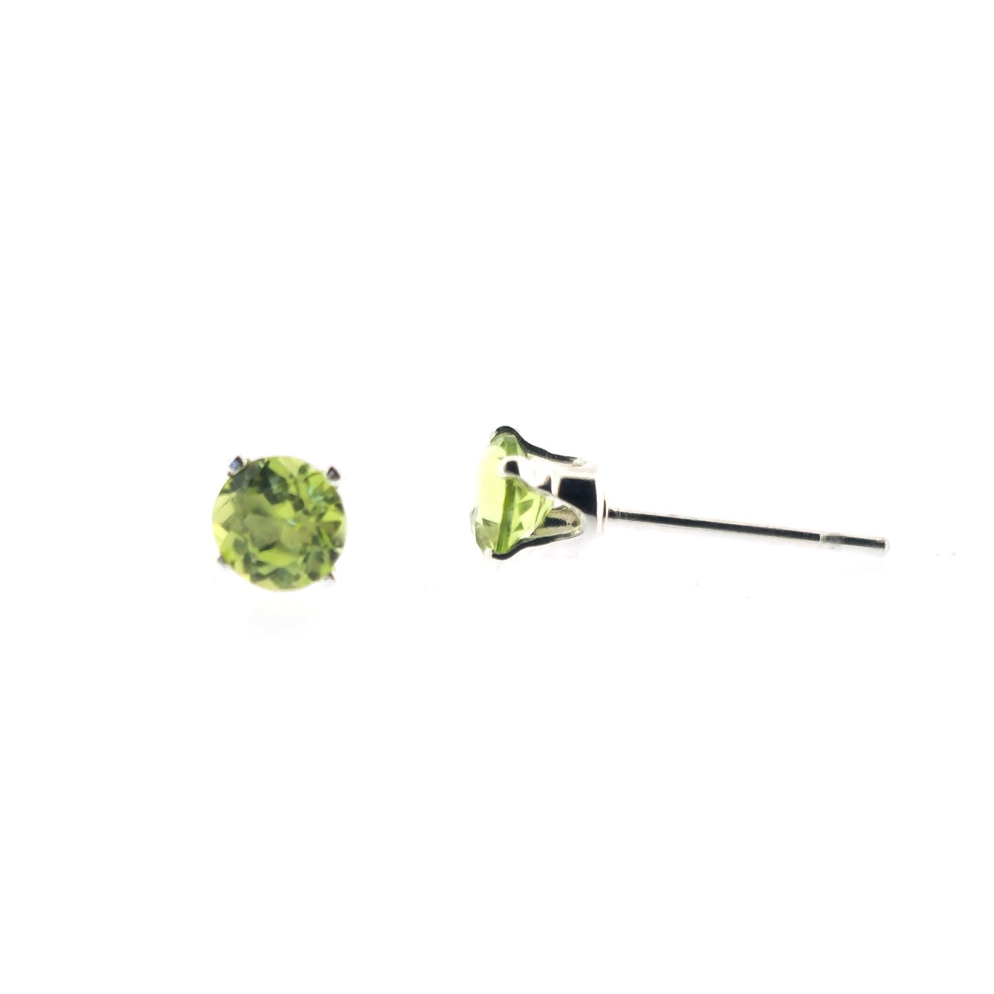 Silver stud earrings with light green round faceted peridot gemstones in a 4 claw setting. 1 in front view, 1 in side view.