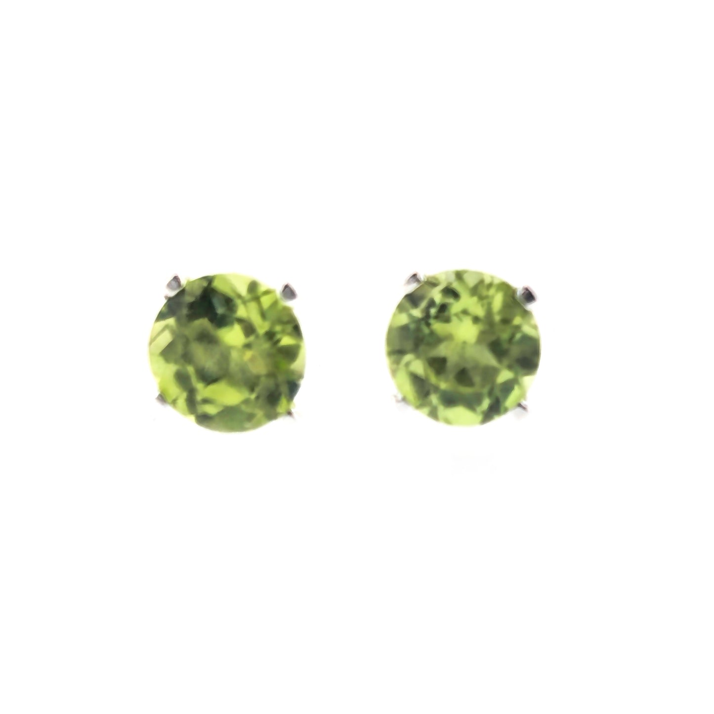 Silver stud earrings with light green round faceted peridot gemstones in a 4 claw setting. Front view.