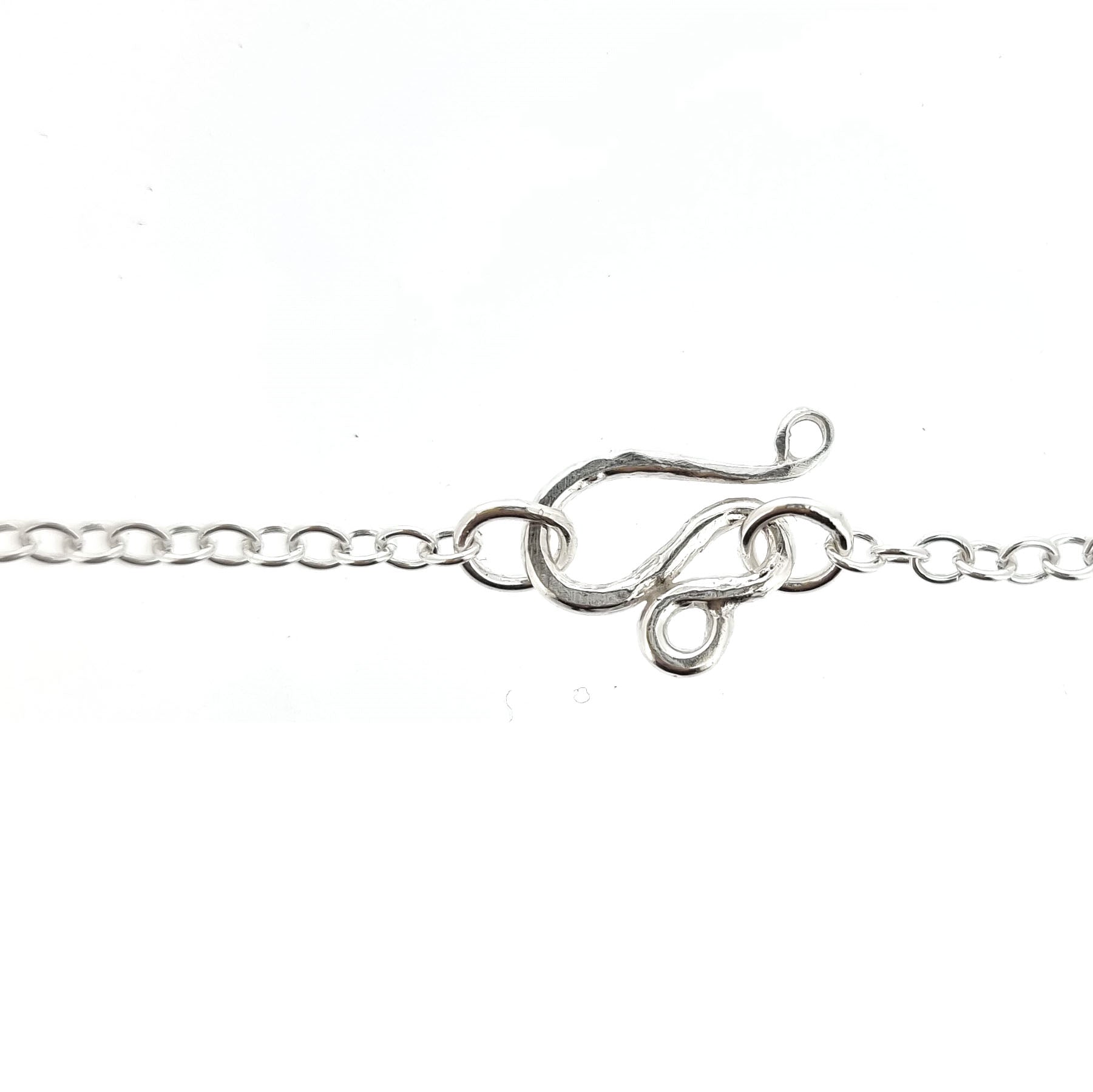 A chain necklace showing the handmade s-clasp.