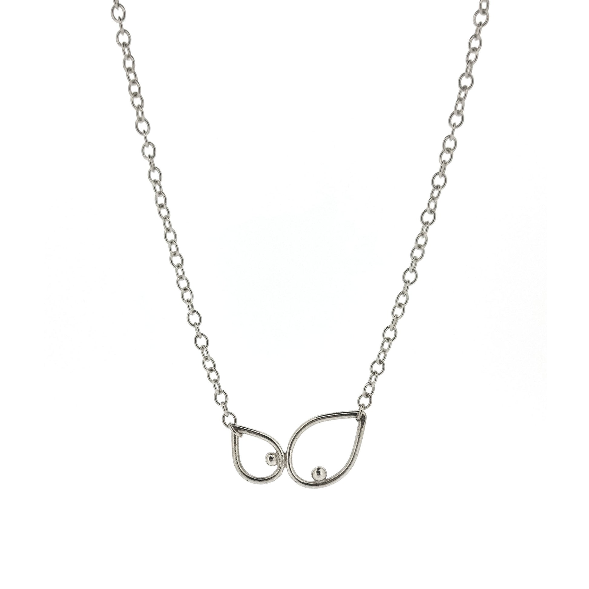 A silver chain necklace with 2 open teardrop shapes at the centre. Each teardrop has an off-centre ball.
