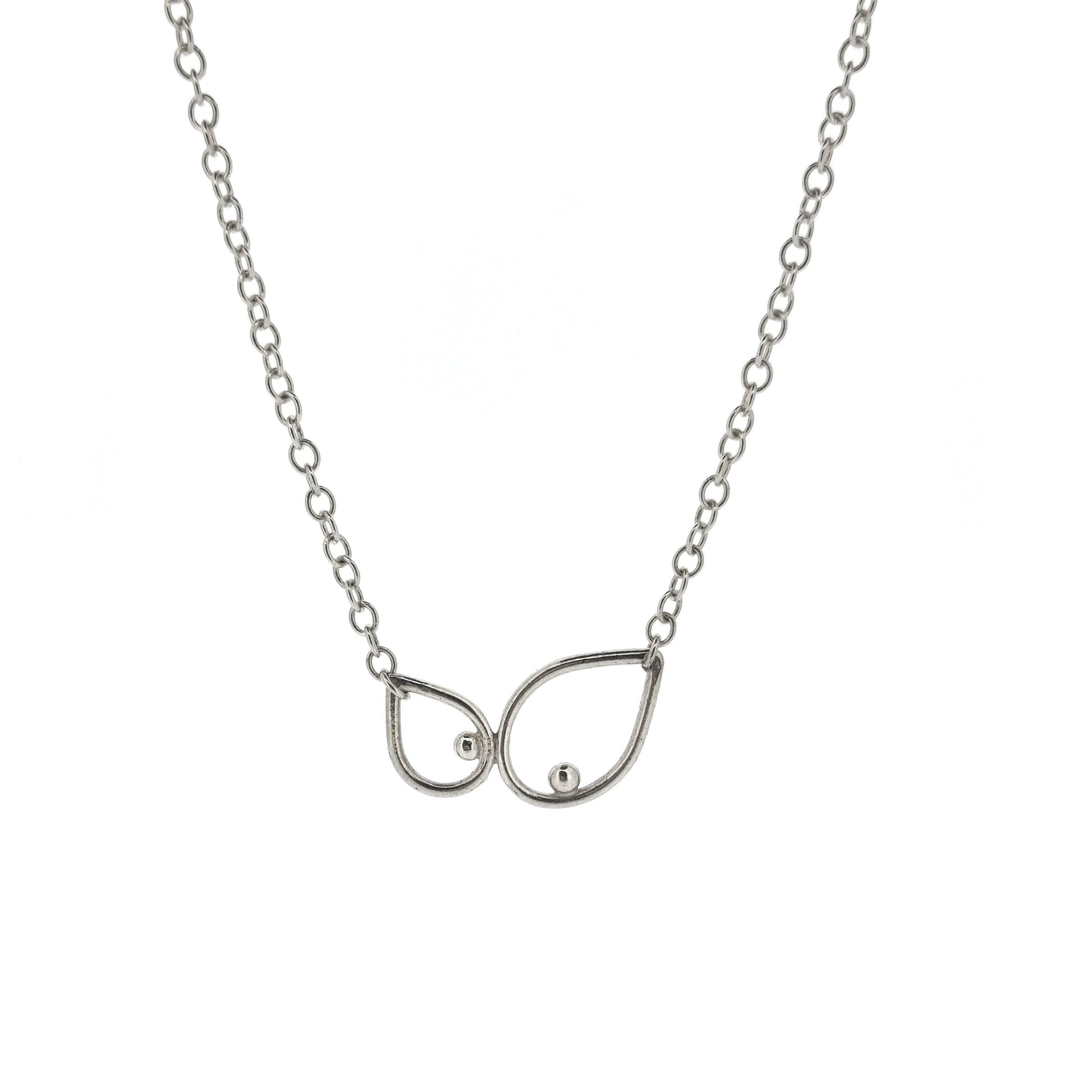 A silver chain necklace with 2 open teardrop shapes at the centre. Each teardrop has an off-centre ball.