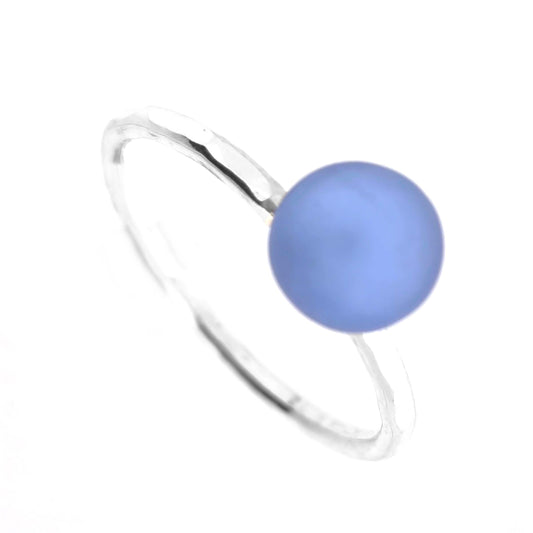 A ring made up of a thin silver band with a hammered finish and a lavender blue glass sphere on top. Mijoux Creations.