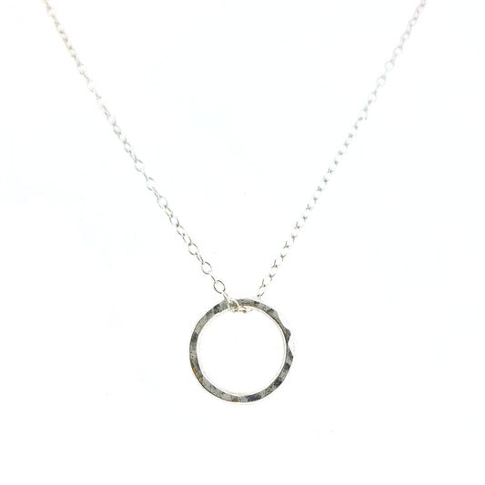 Silver hammered open circle pendant on silver chain - small