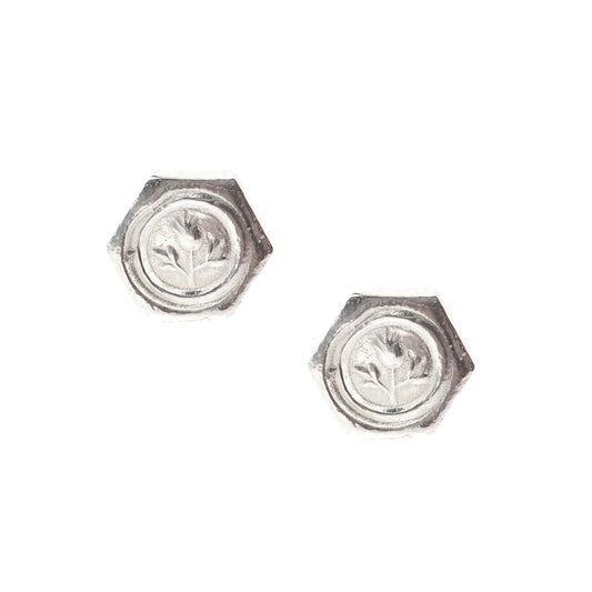 A pair of hexagon shaped sterling silver stud earrings with a thistle on them.
