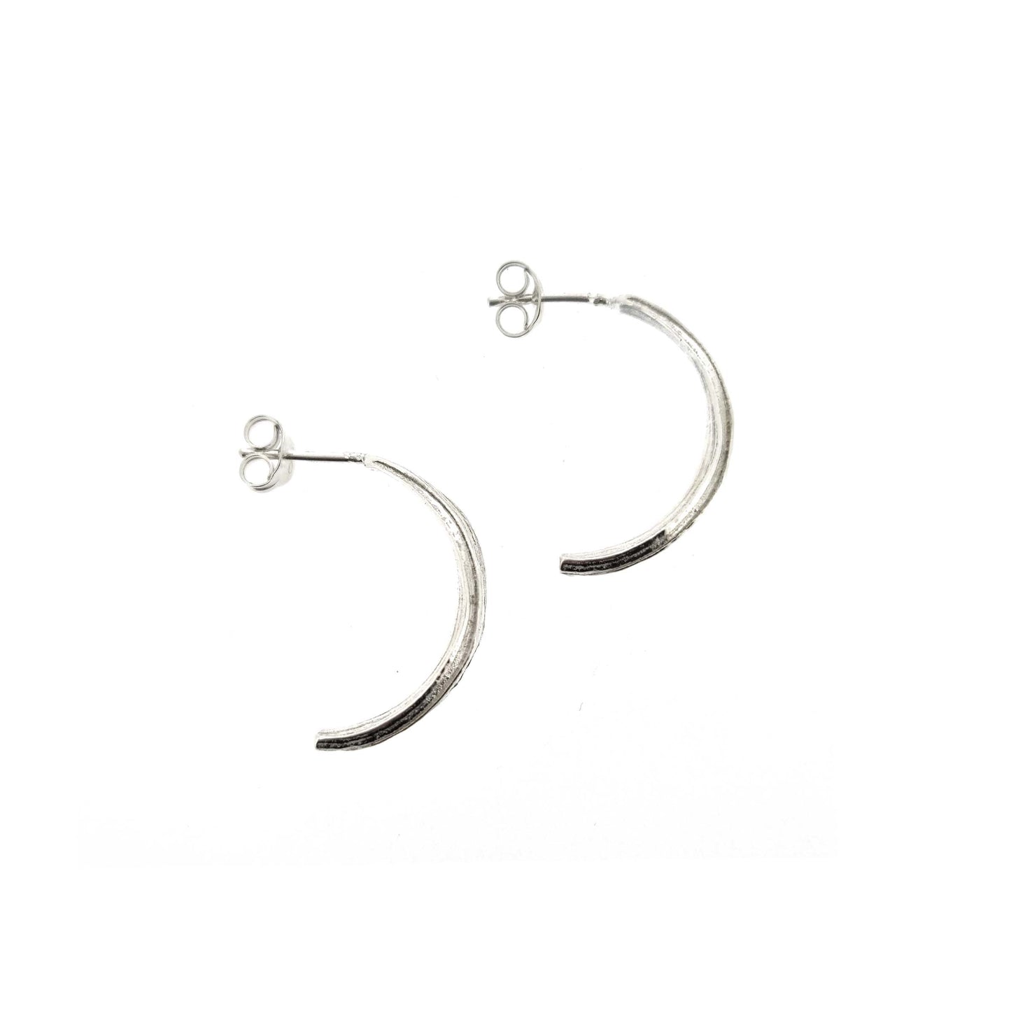 Silver line textured half hoop earrings.