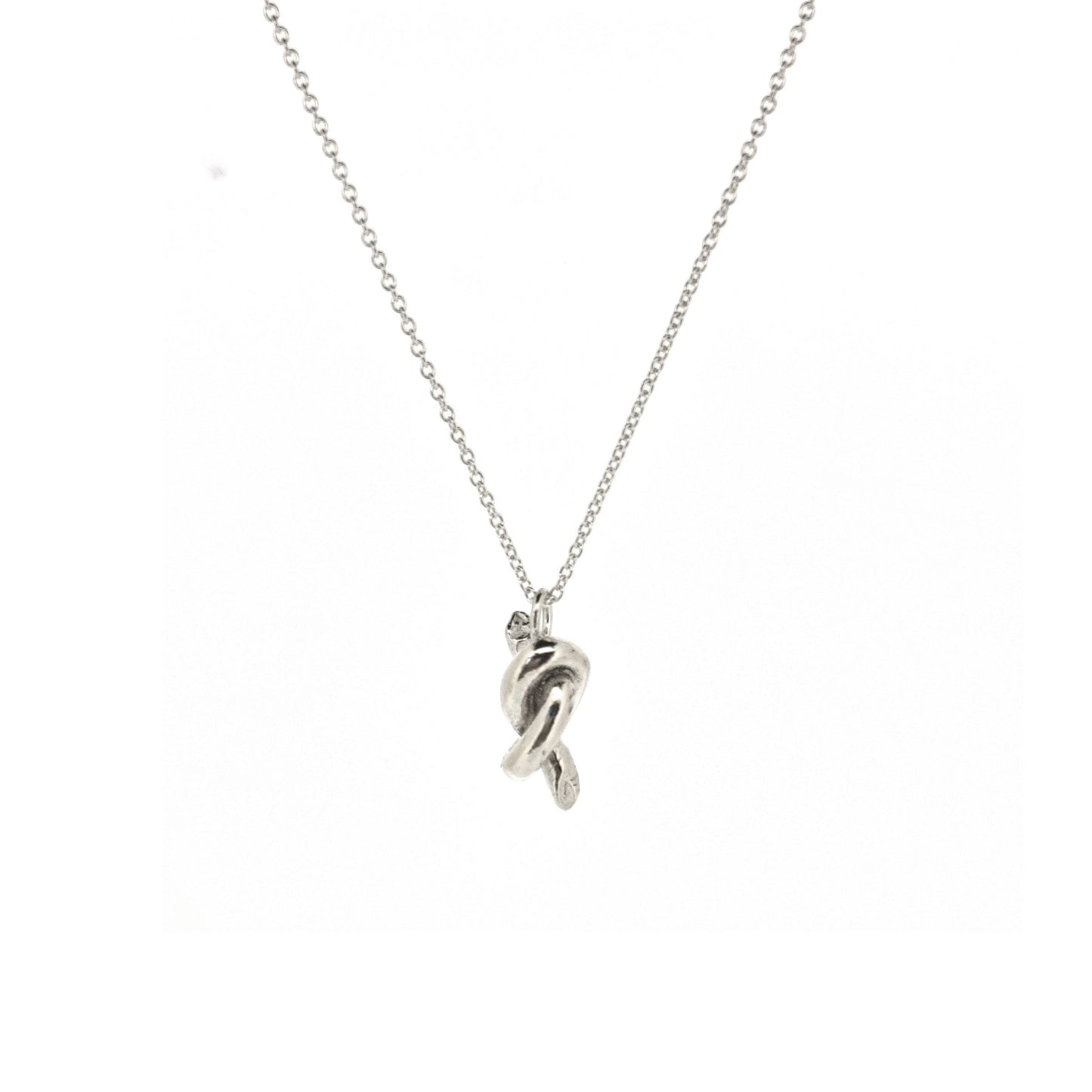 Silver chain with a silver knot pendant.