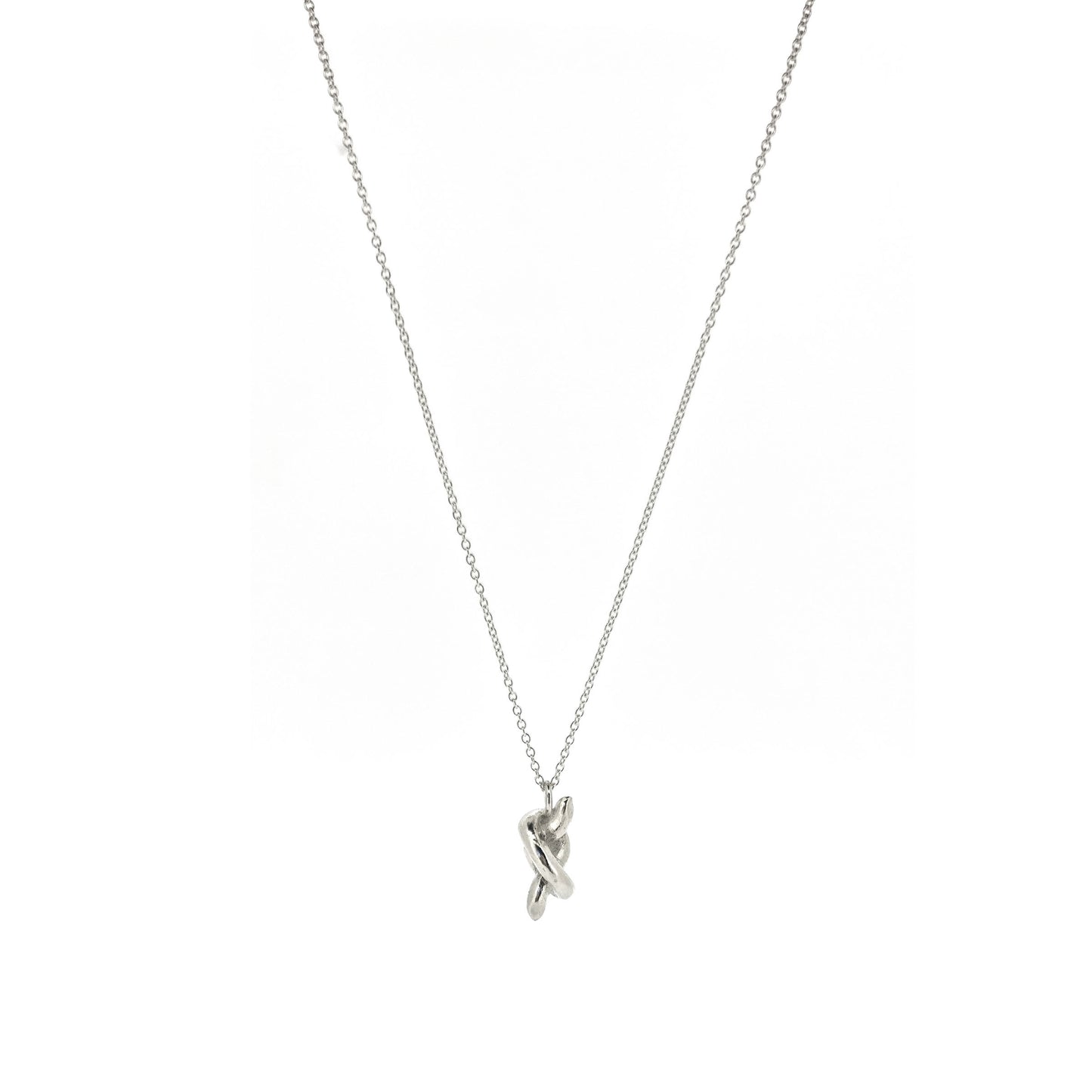 Silver chain with a silver knot pendant.