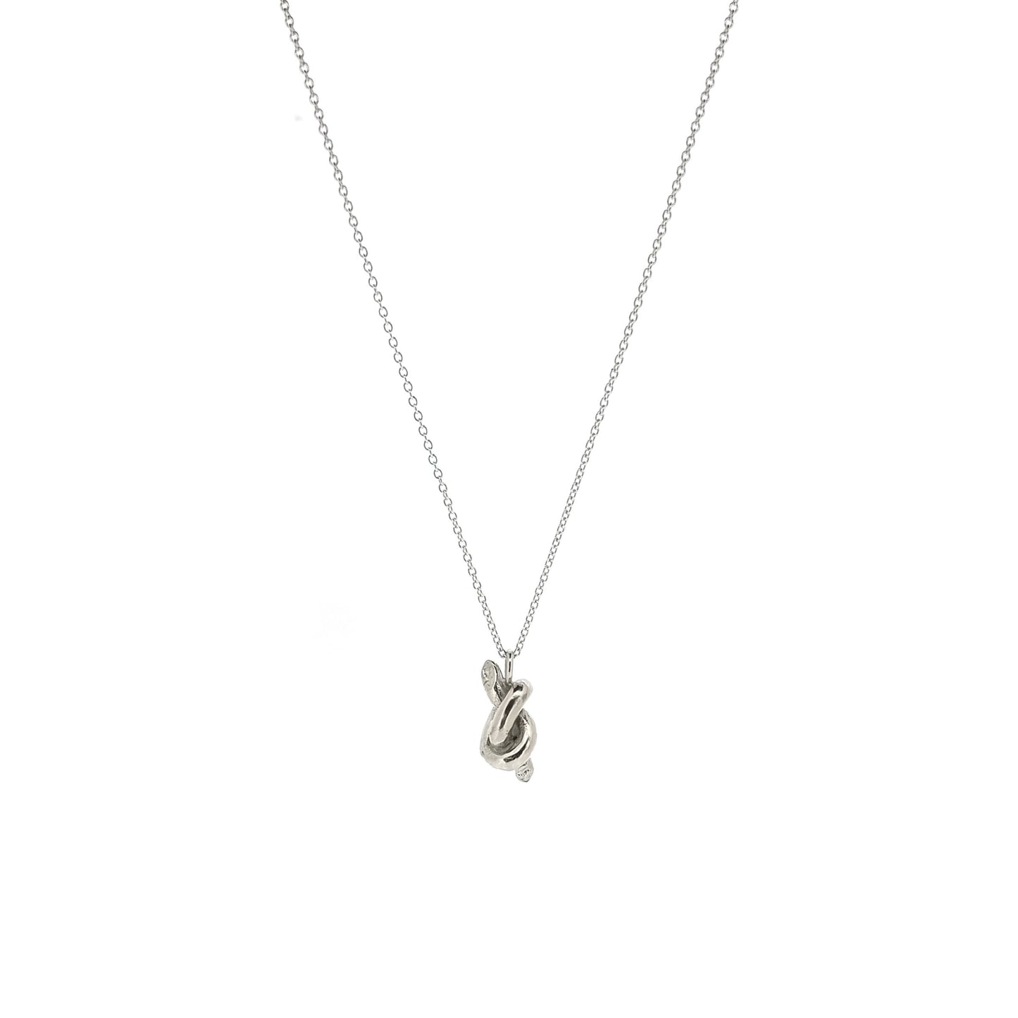 Silver chain with a silver knot pendant.