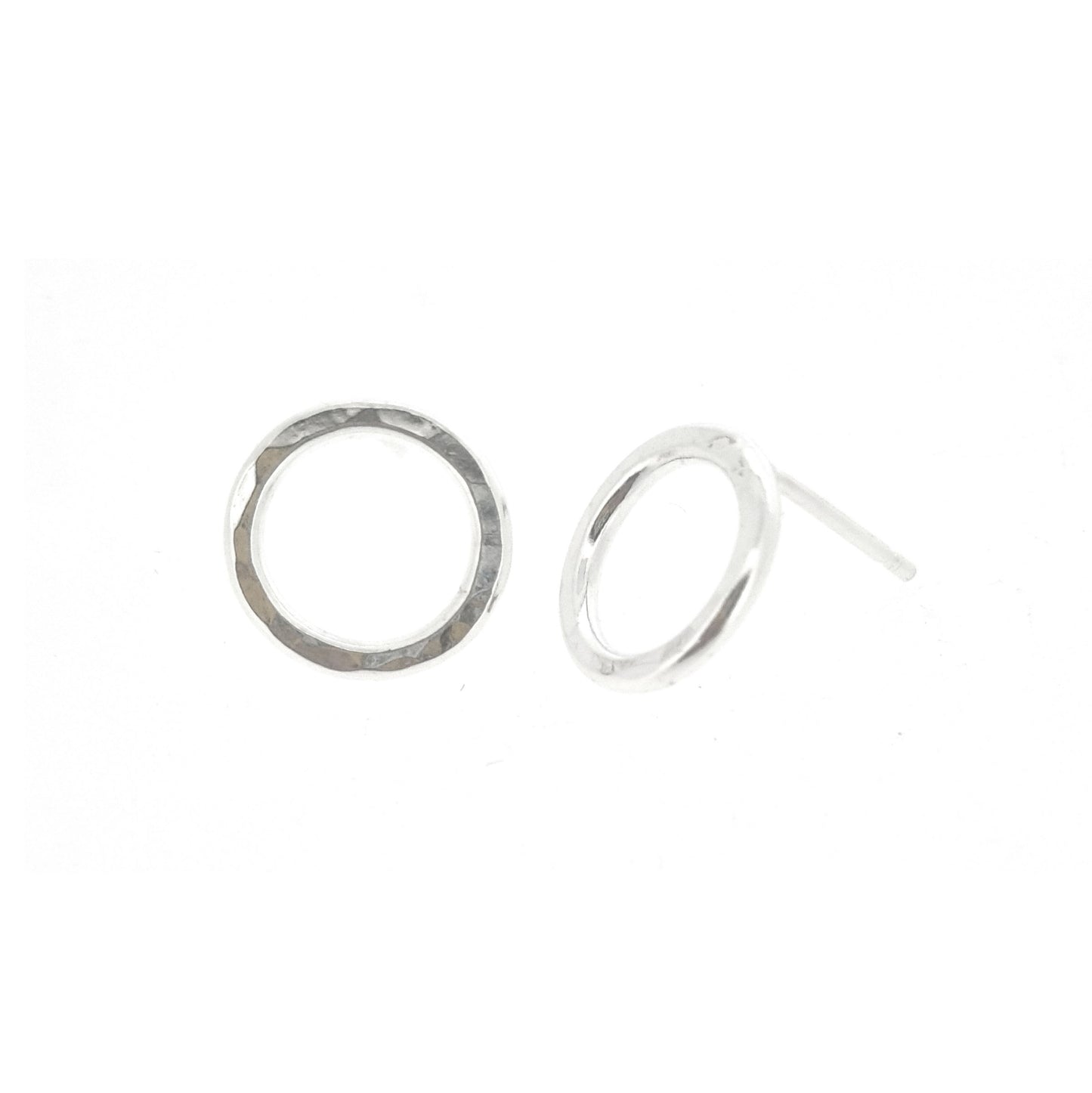 Silver open circle stud earrings with hammered texture.