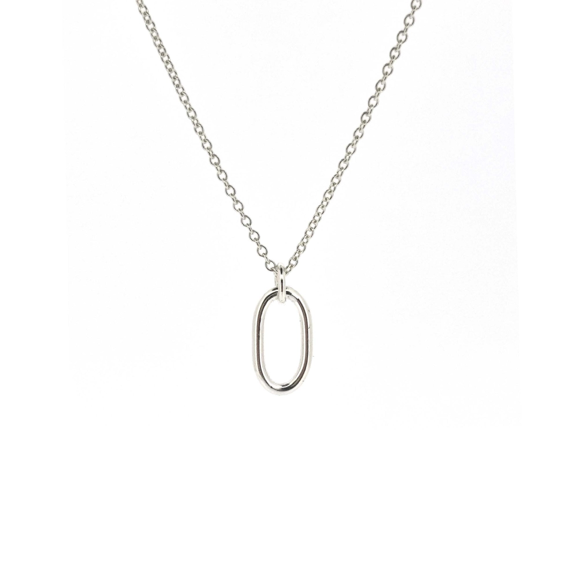 An open oblong pendant on a silver chain.