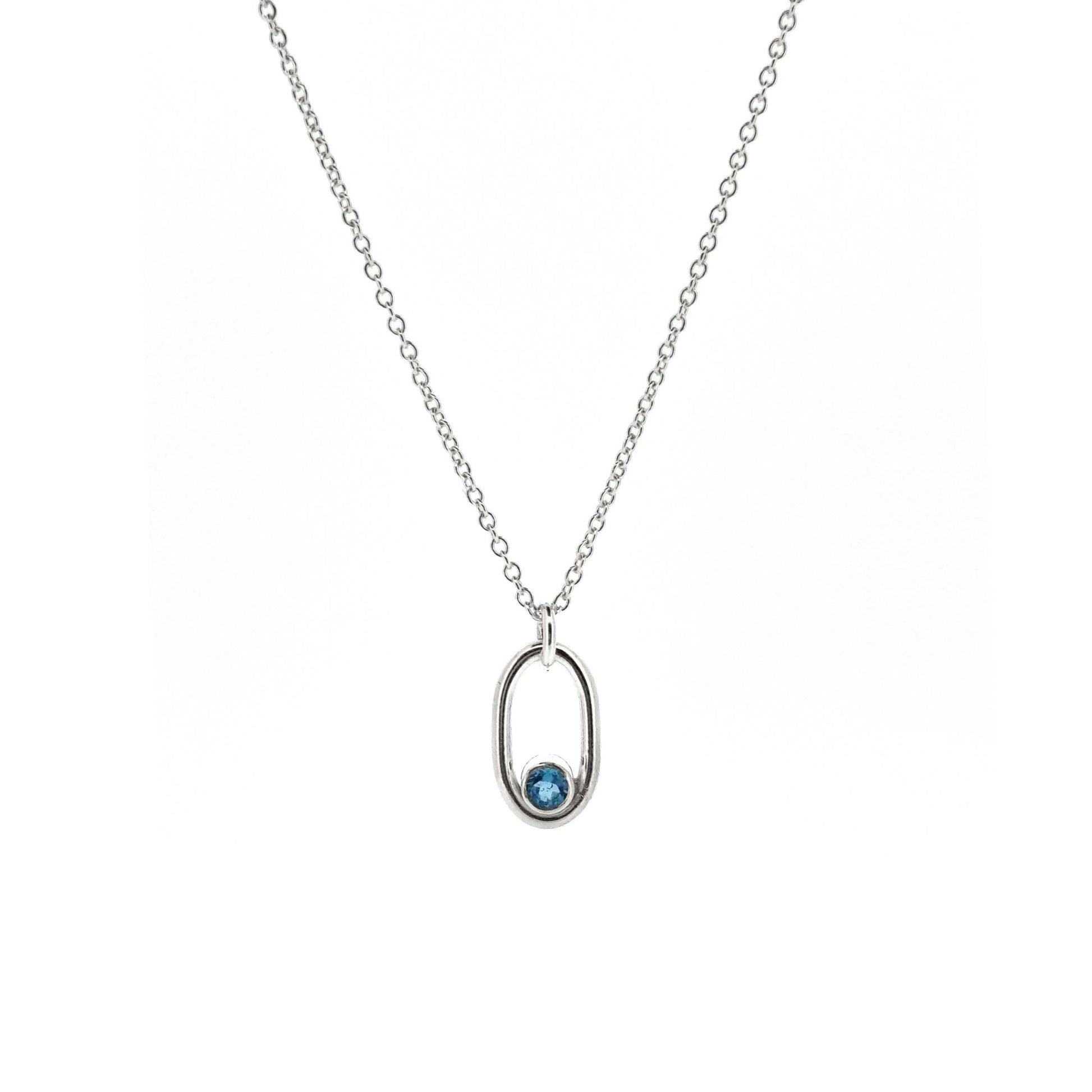 Silver open oblong pendant with a blue topaz gemstone set in the curve on a silver chain.