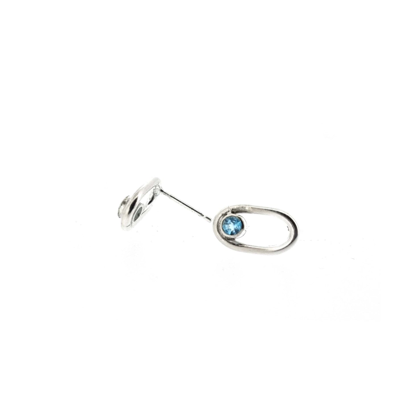Silver open oblong stud earrings with a blue topaz gemstone set inside one curve.