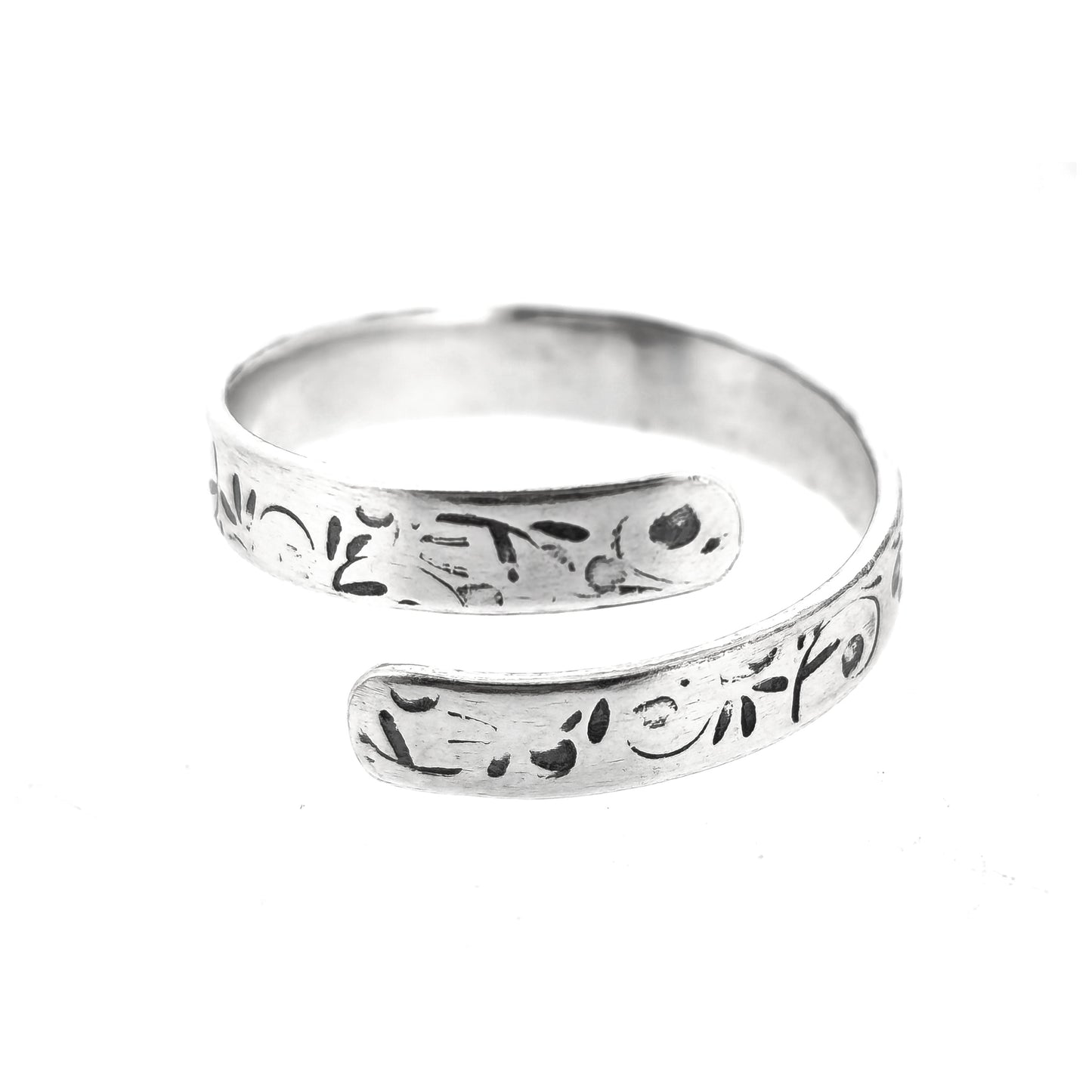 A handmade flat silver band wrap ring with leaf, bud and stalk pattern.