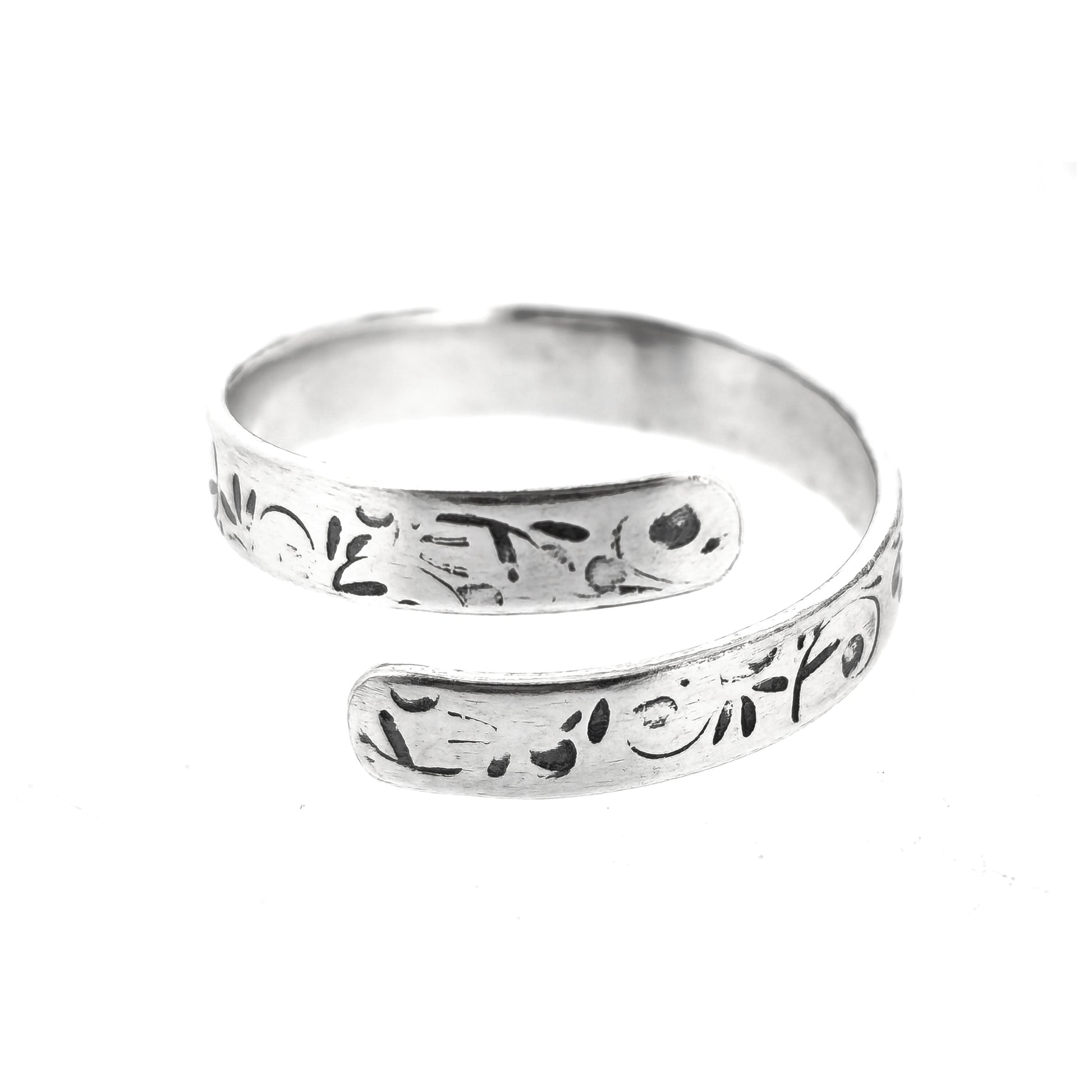 A handmade flat silver band wrap ring with leaf, bud and stalk pattern.
