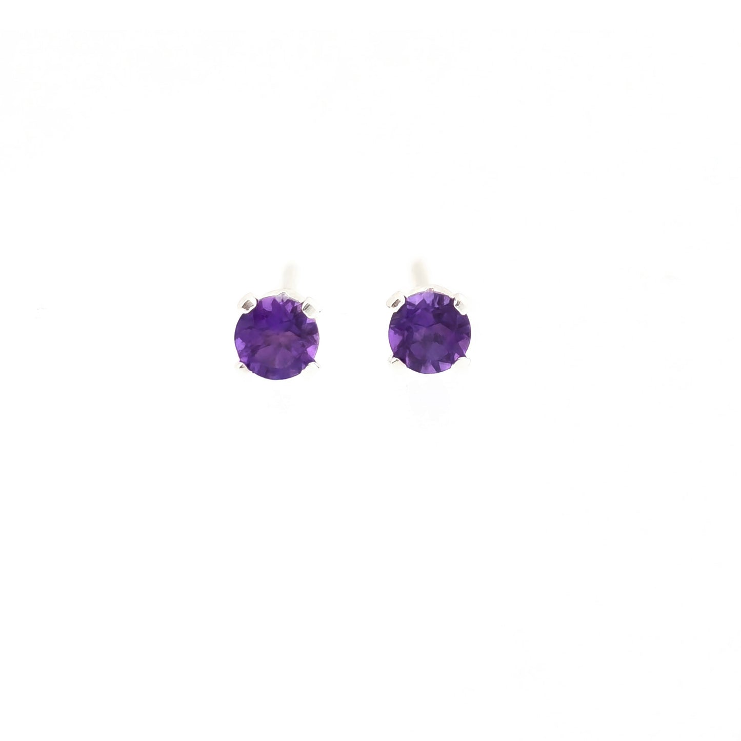 Silver 4 claw stud earrings set with purple amethyst gemstones. 3mm.