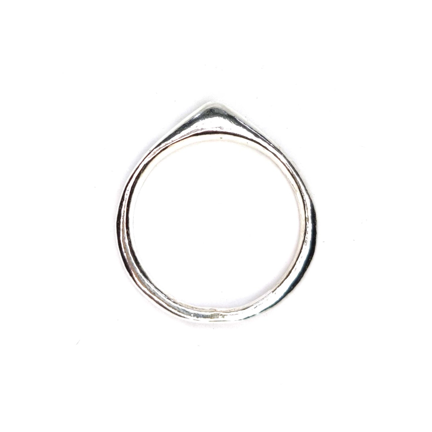 A silver ring which comes to a soft point at the top.