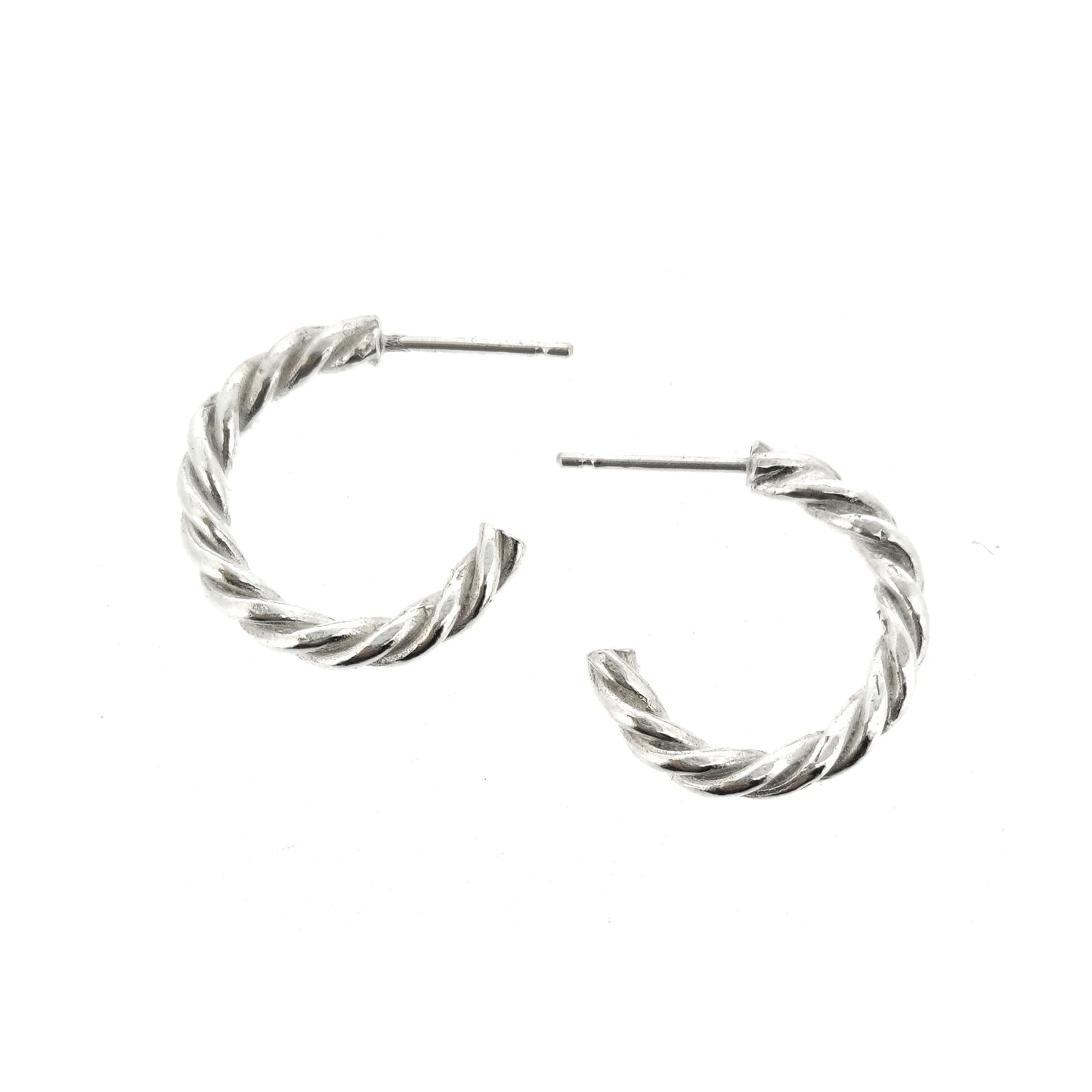 Silver twisted rope hoop earrings. Side view.