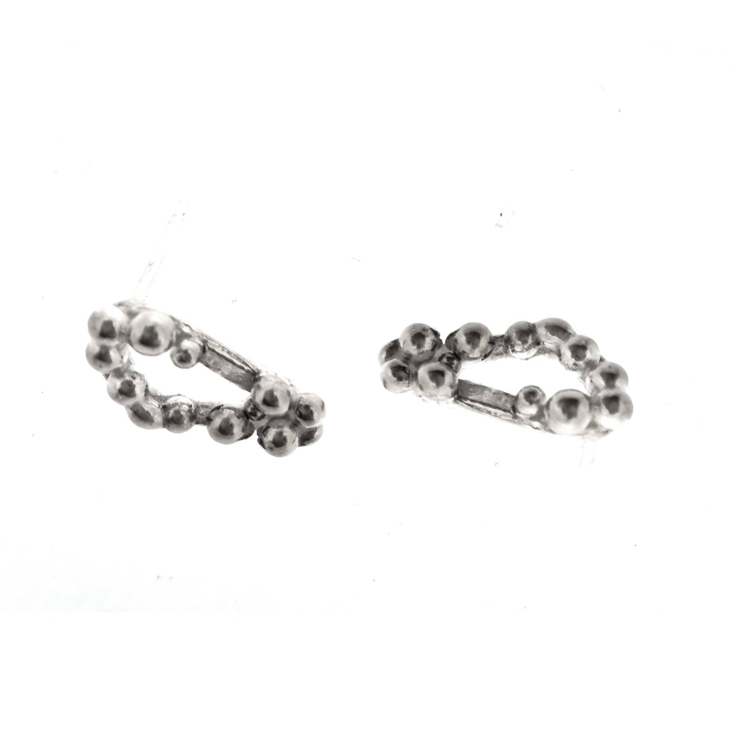 Silver stud earrings with an open soft triangle shape and silver balls.
