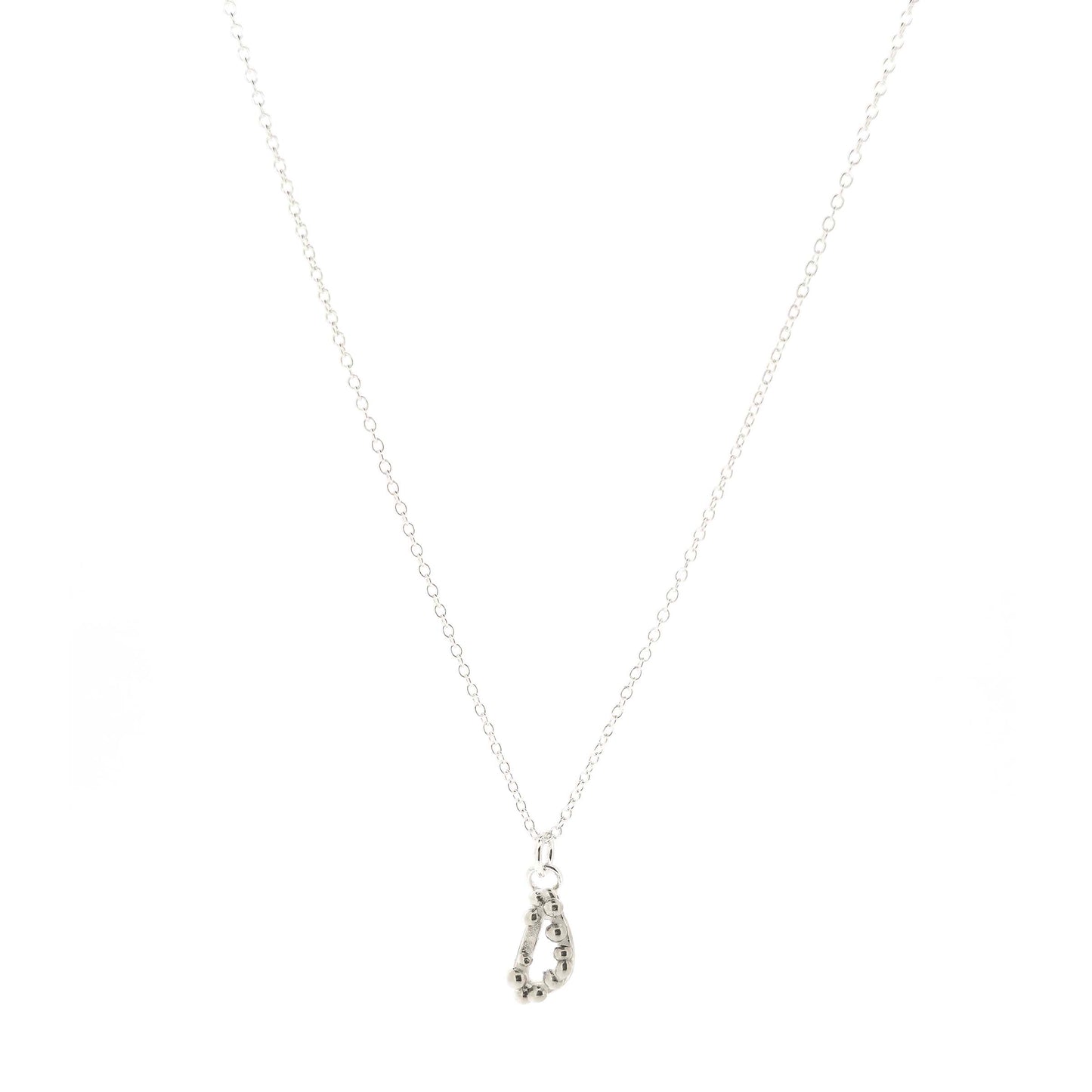 Silver asymmetric open triangle pendant with silver balls on a silver chain. Shown on a white background.