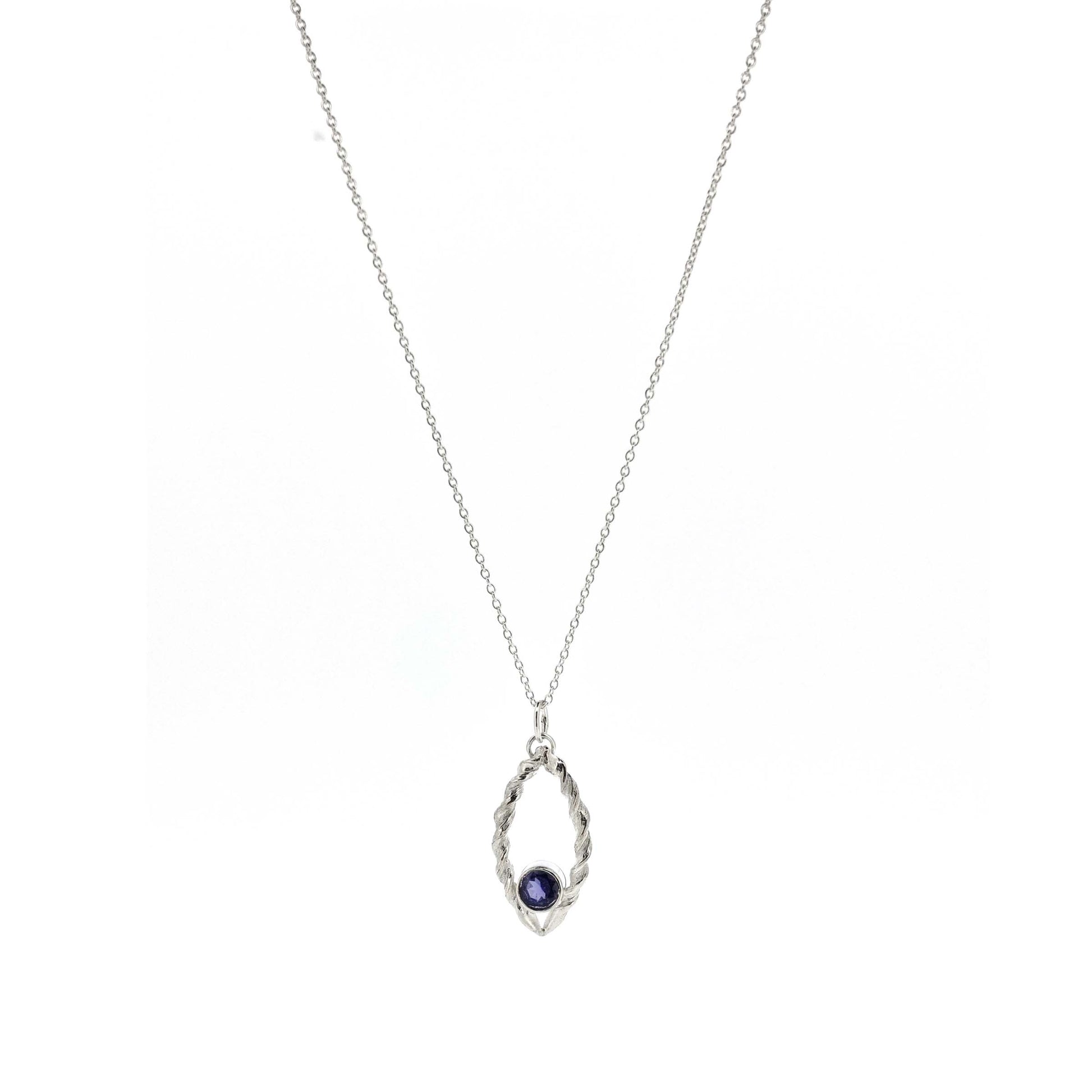 Silver pendant featuring 2 twists of silver making an open boat shape with a purple blue iolite gemstone set in the bottom point. On a silver chain.