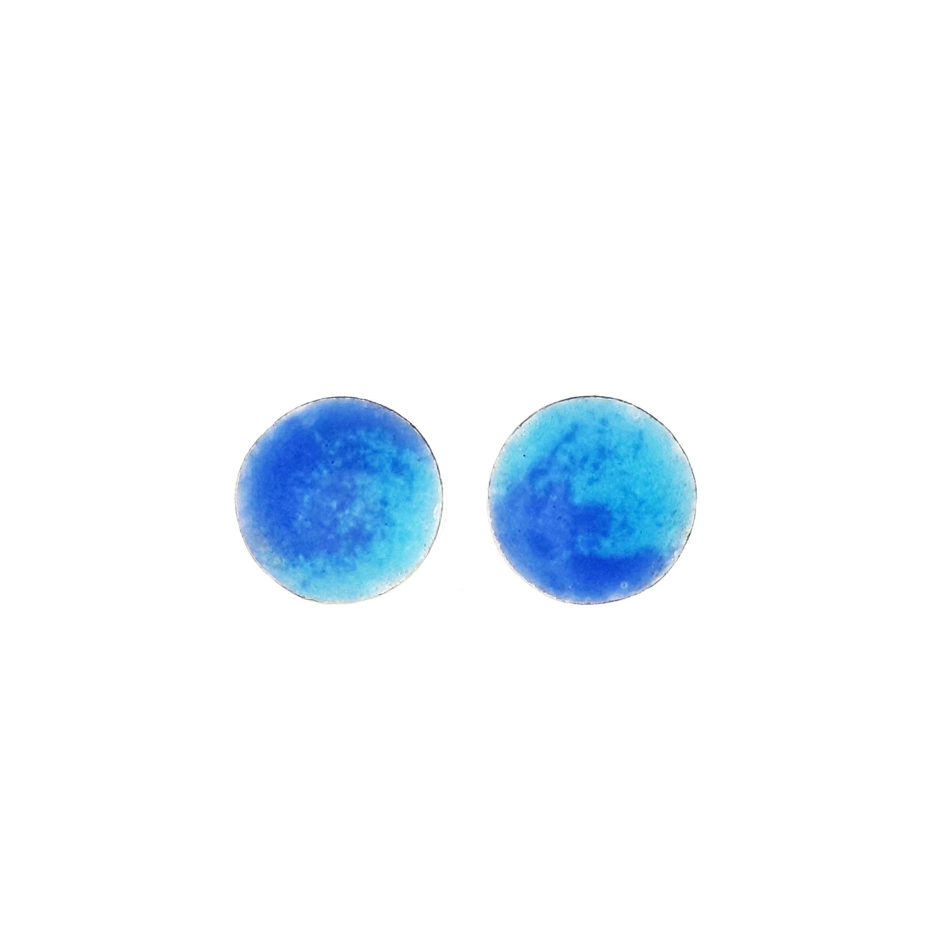 Round silver stud earrings with a mix of blue enamels.