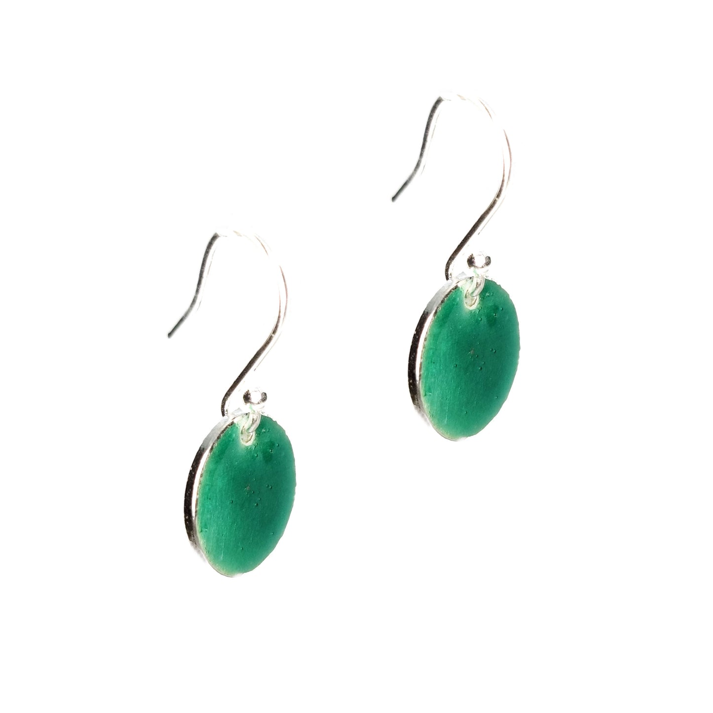 Silver drop earrings with a round disc covered in turquoise green enamel.
