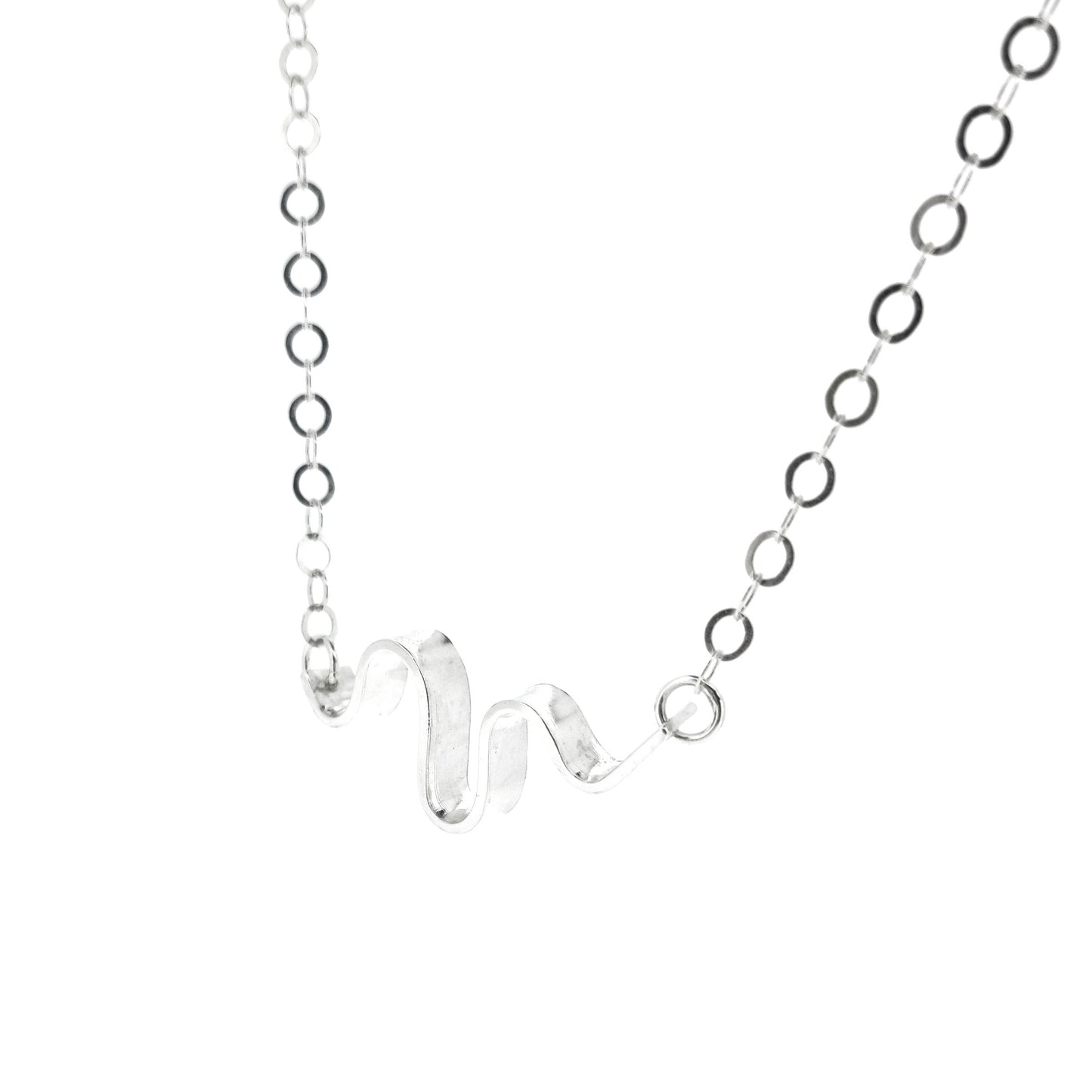 A silver necklace with an open chain and a wave of silver at the center.