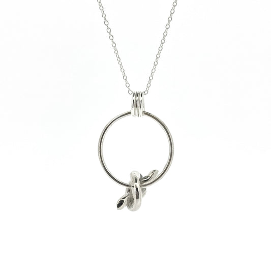 Silver circle pendant with spinning knot charm and triple circle bail. Suspended on a silver chain.