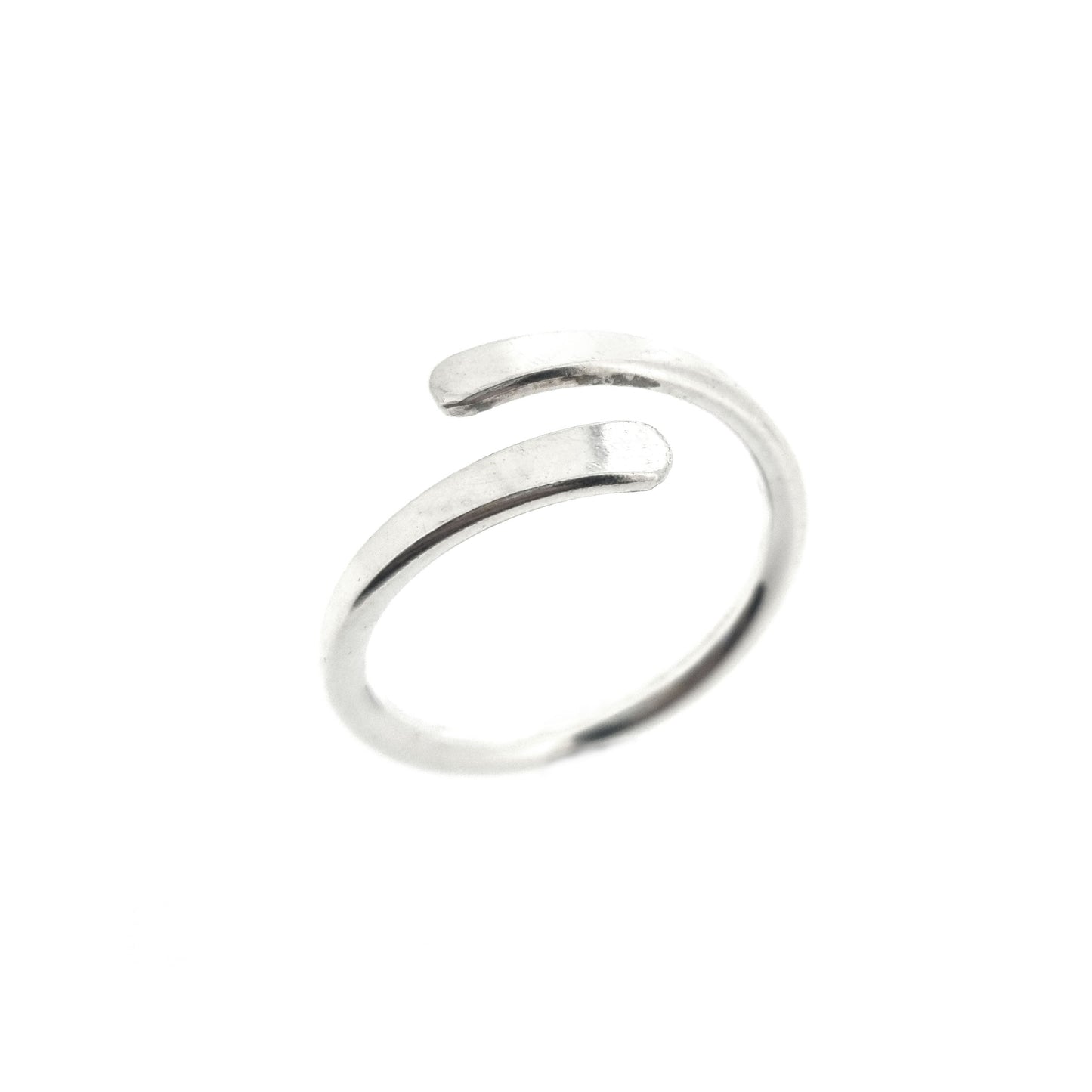 Silver cross over ring with flared & flattened ends.