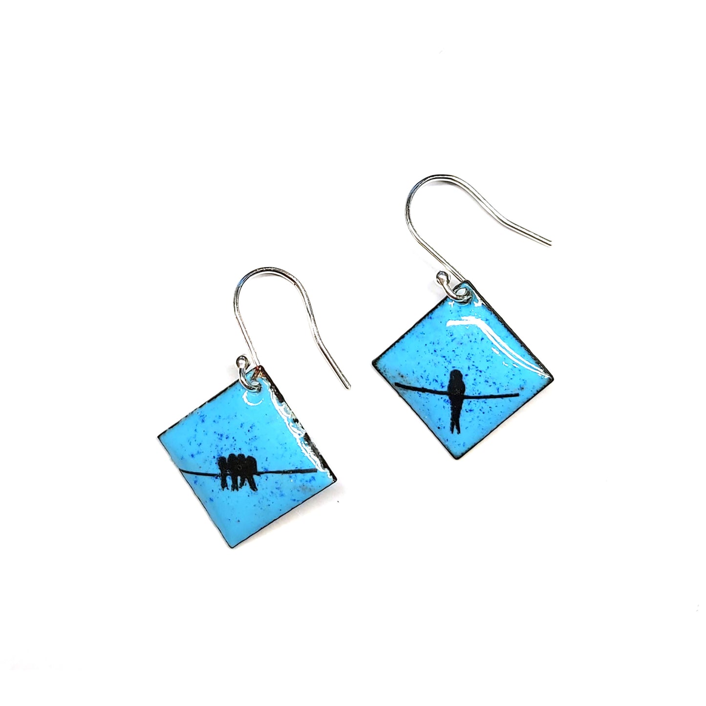 Square drop earrings featuring silhouettes of birds sitting on a wire against a blue enamel background.