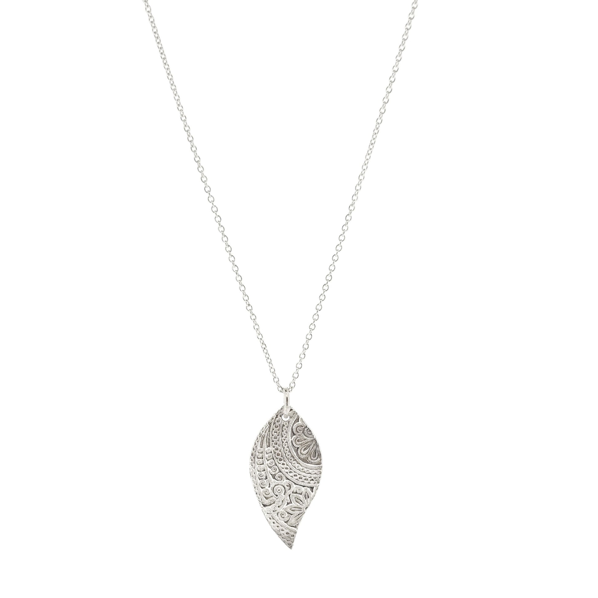 A silver asymmetric patterned leaf-shaped pendant on a chain