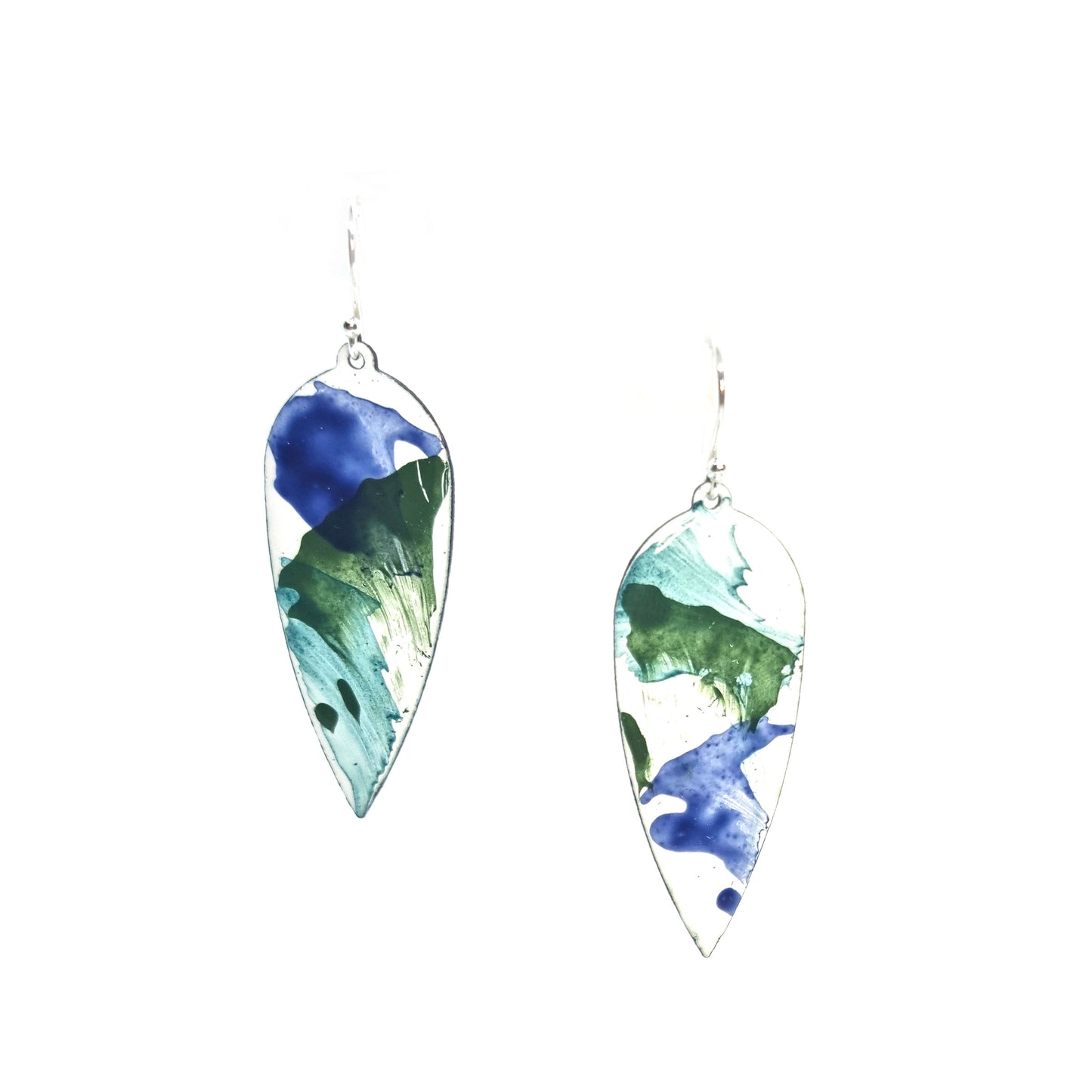 Large teardrop-shaped enamel drop earrings with splashes of dark blue and green on a white background