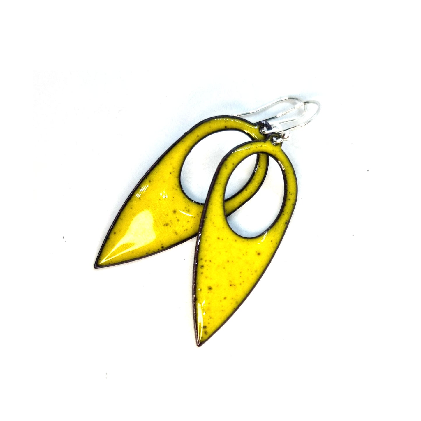 Yellow enamel teardrop shaped drop earrings with a cut out hole. On silver ear wires.