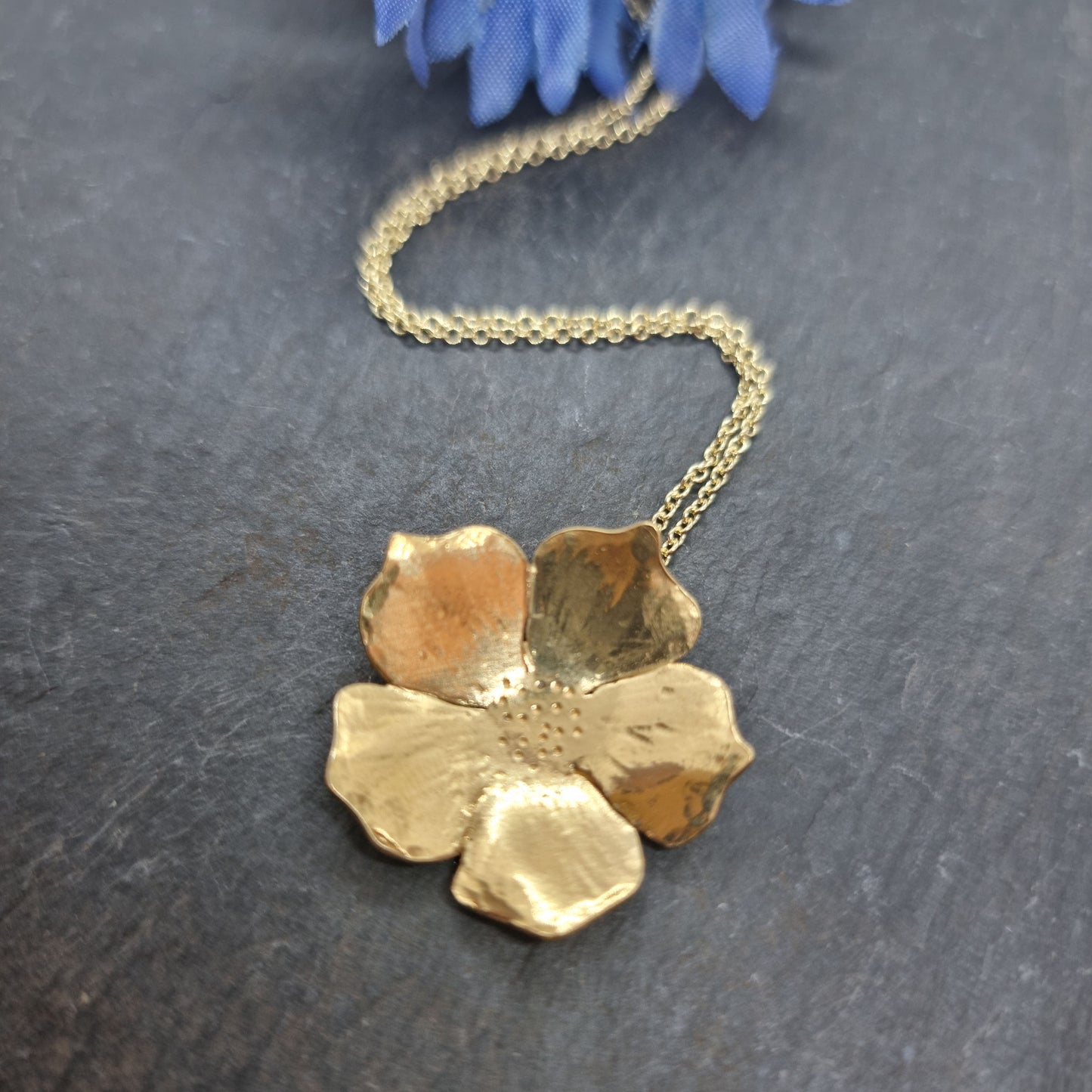 A yellow gold vermeil 5 petal flower pendant on a yellow gold vermeil chain. Large.