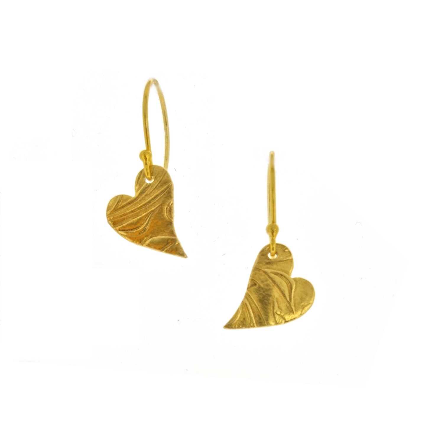 Yellow gold vermeil drop earrings featuring an asymmetrical heart with a leaf vine pattern suspended from an ear wire.