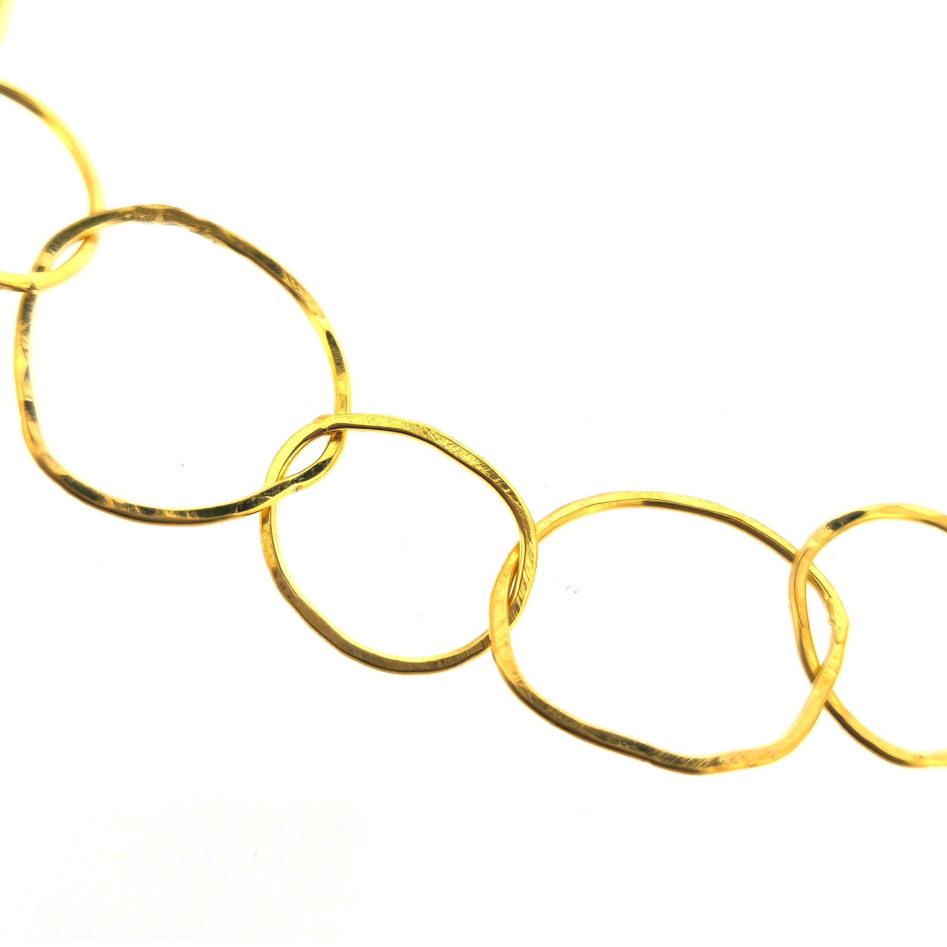 A yellow gold vermeil chain necklace with organic style circular links.