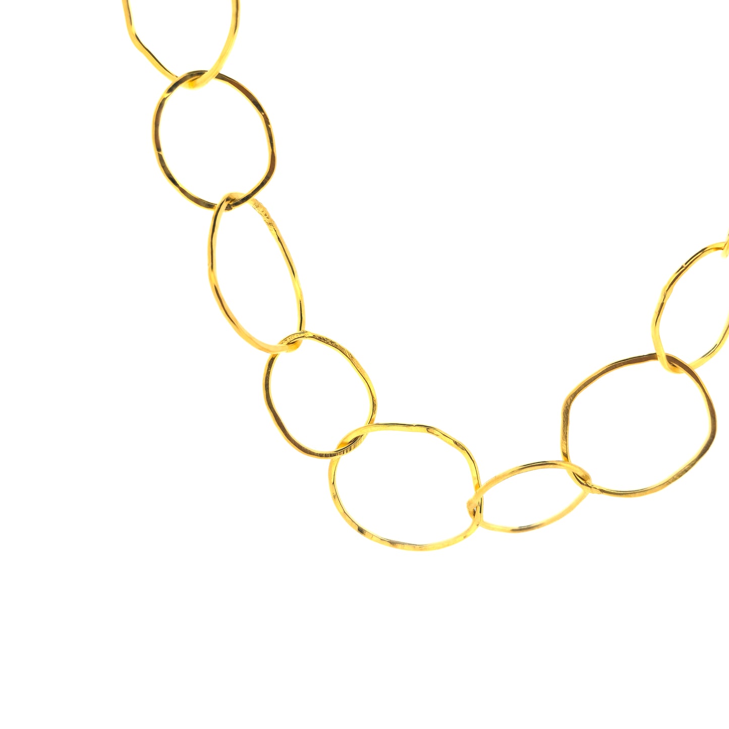 A yellow gold vermeil chain necklace with organic style circular links.