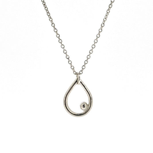 A silver open teardrop shaped pendant with an off-centre ball. On a silver chain. Small.