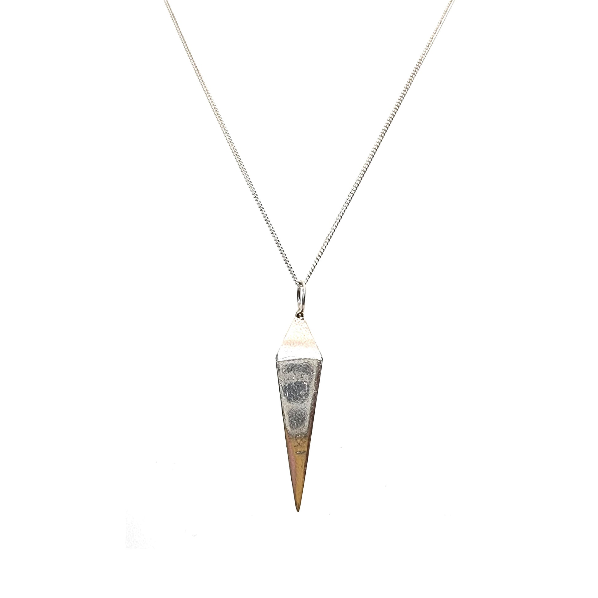 A silver geometric diamond shaped pendant on a silver chain.